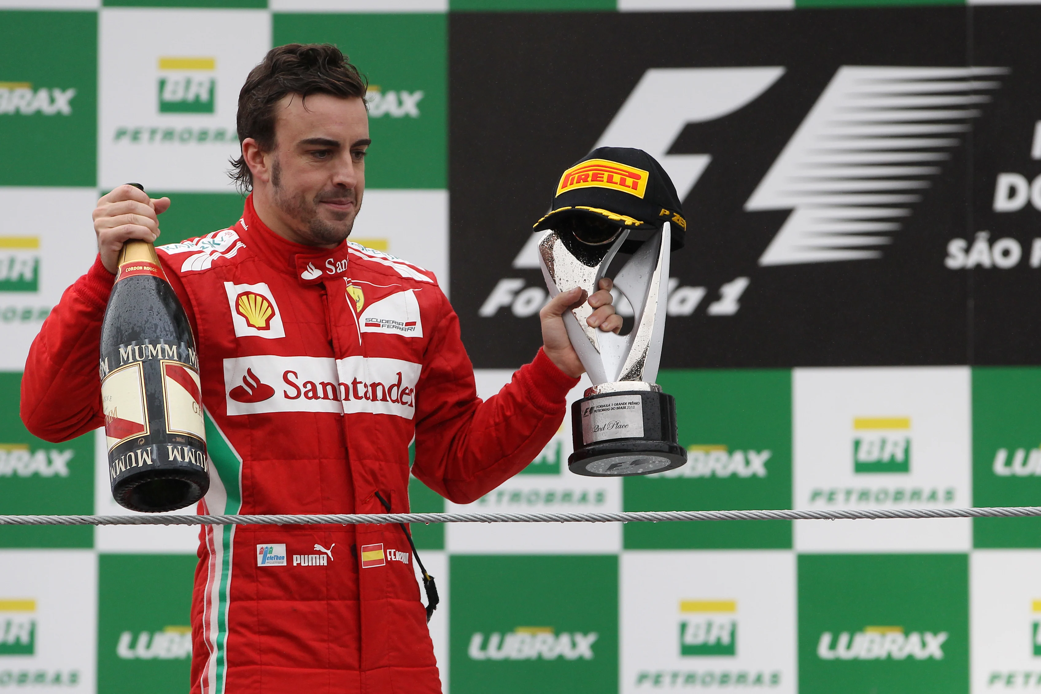 Second placed Fernando Alonso (ESP) Ferrari celebrates on the podium. Formula One World