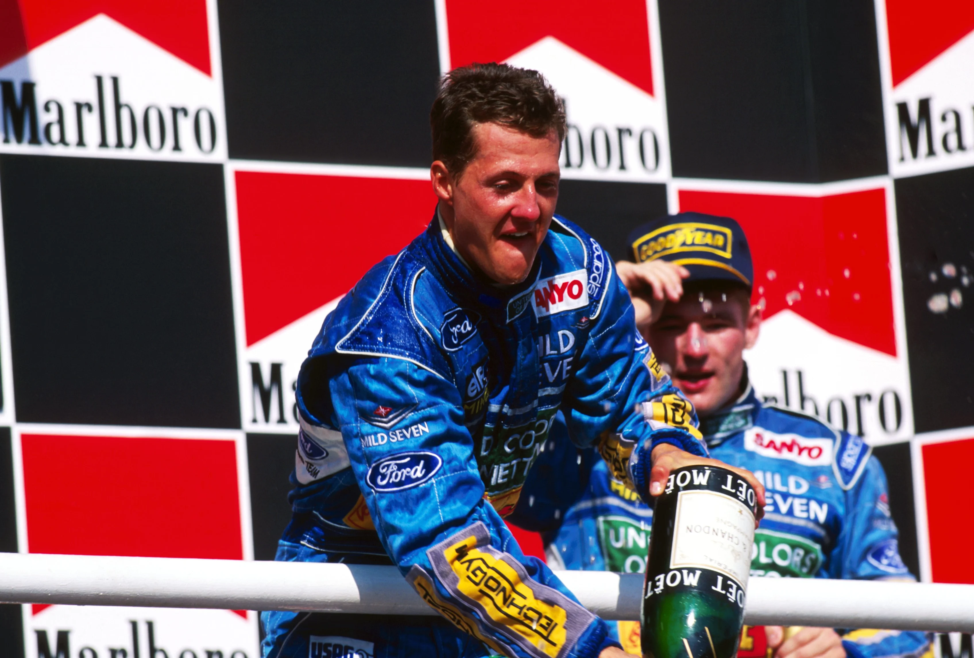 Race winner Michael Schumacher (GER) Benetton celebrates on the podium. His team mate Jos