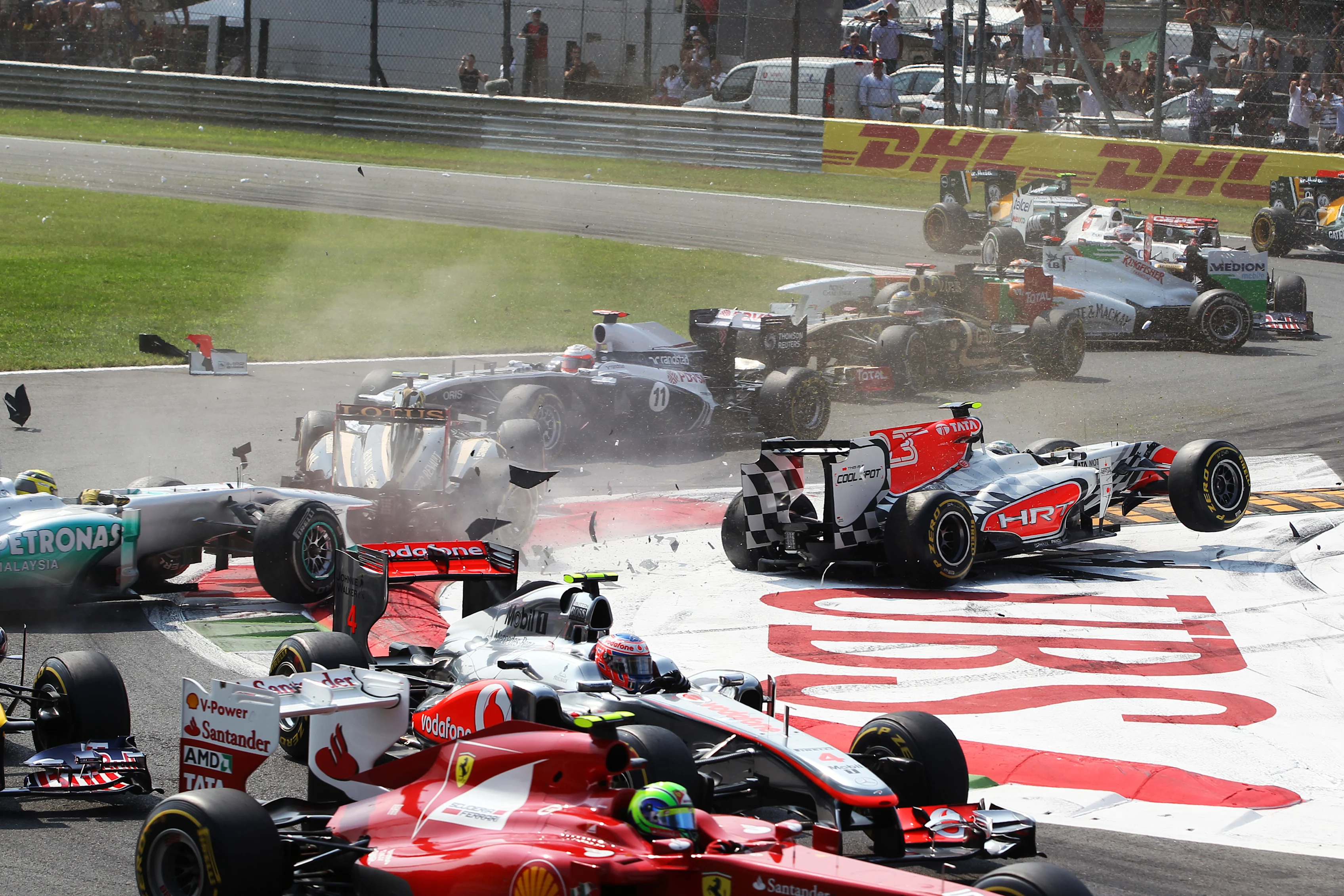 Vitantonio Liuzzi (ITA) HRT Formula 1 Team F111 crashes into Vitaly Petrov (RUS) Lotus Renault GP