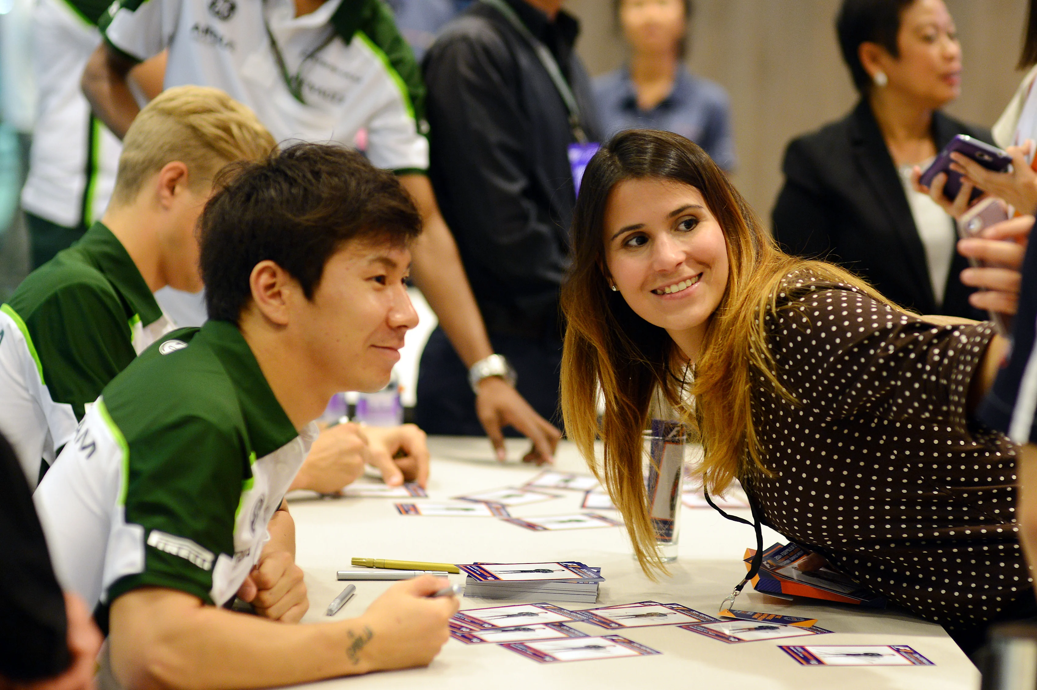 Kamui Kobayashi (JPN) Caterham with a fan in the autograph session.
Formula One World Championship, Rd14, Singapore Grand Prix, Marina Bay Street Circuit, Singapore, Preparations, Thursday 18 September 2014.