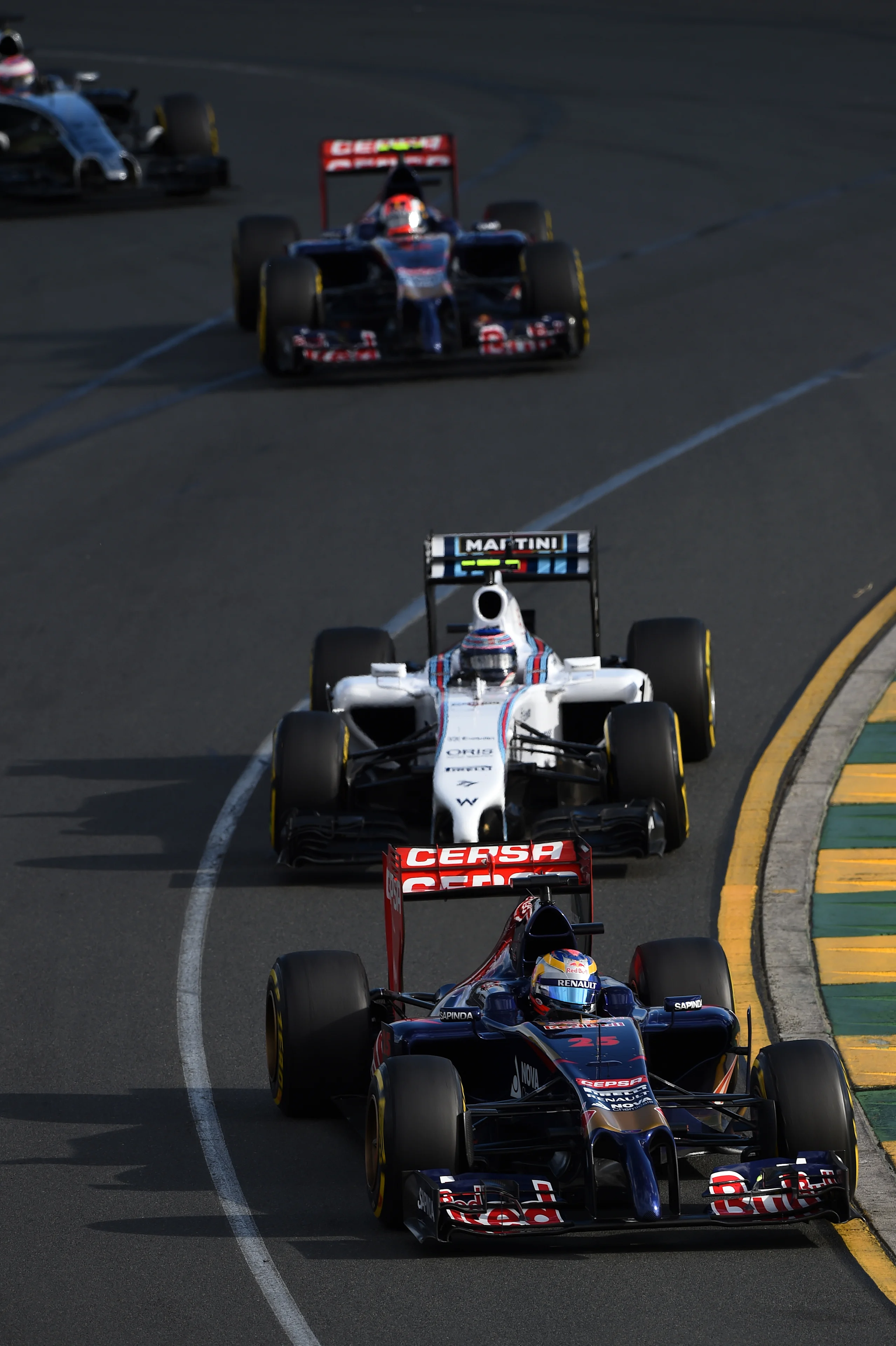 Jean-Eric Vergne (FRA) Scuderia Toro Rosso STR9 leads Felipe Massa (BRA) Williams FW36. Formula
