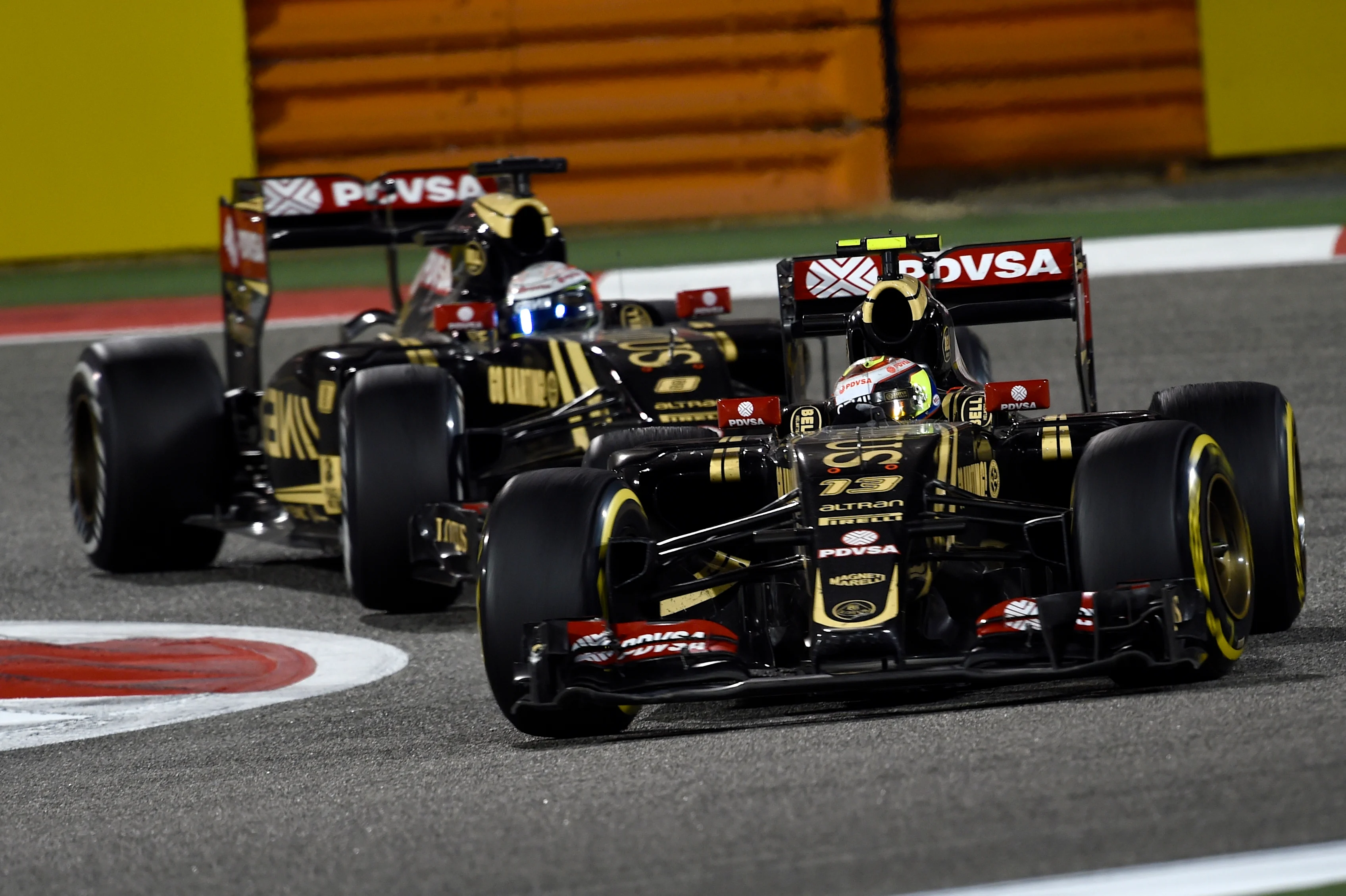 Pastor Maldonado (VEN) Lotus E23 Hybrid leads Romain Grosjean (FRA) Lotus E23 Hybrid at Formula One World Championship, Rd4, Bahrain Grand Prix Race, Bahrain International Circuit, Sakhir, Bahrain, Sunday 19  April 2015. © Sutton Motorsport Images