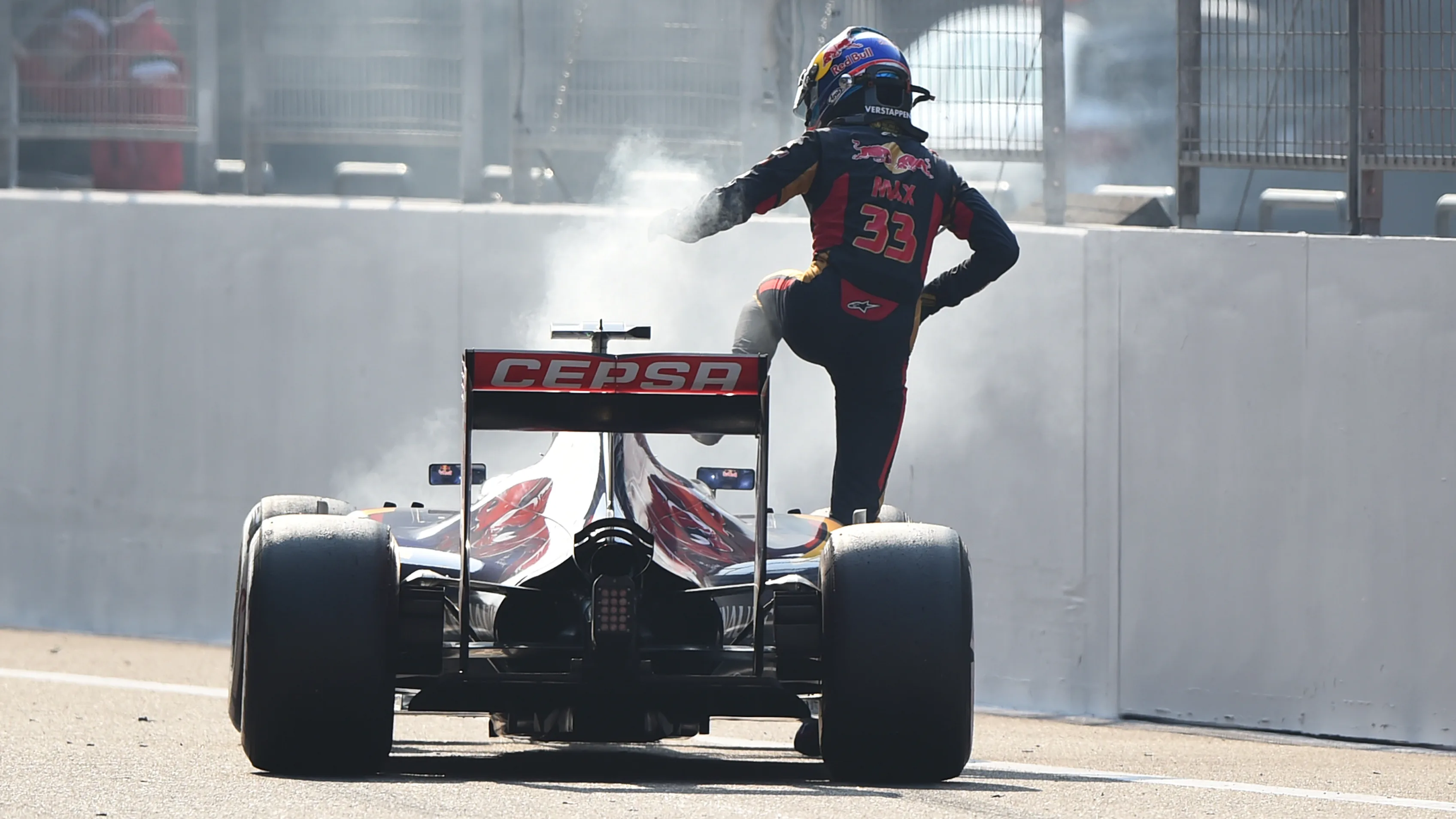 Max Verstappen (NDL) Scuderia Toro Rosso STR10 climbs out of his stricken car after blowing his