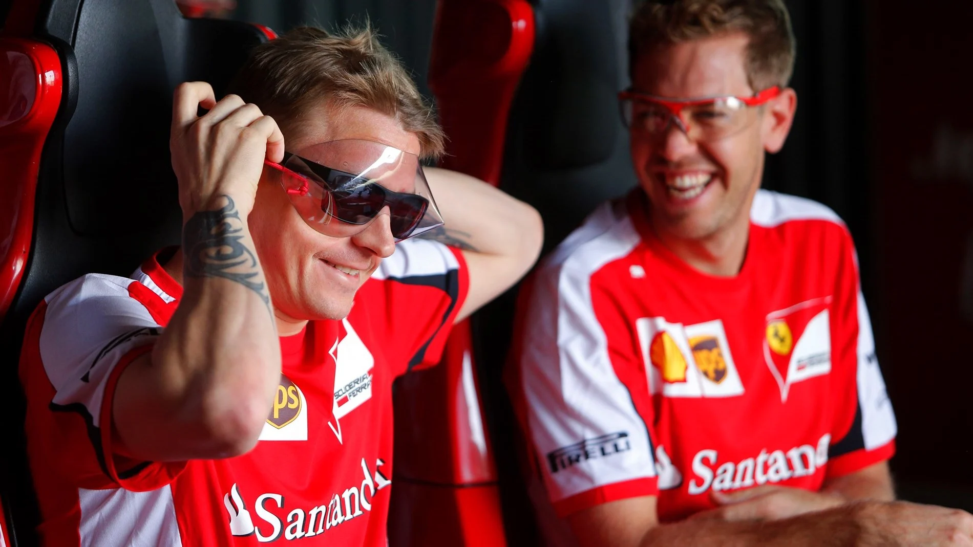 Kimi Raikkonen (FIN) Ferrari and Sebastian Vettel (GER) Ferrari on the rollercoaster at Ferrari