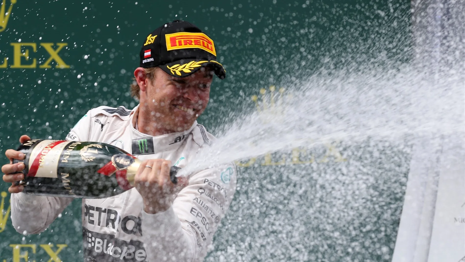 Race winner Nico Rosberg (GER) Mercedes AMG F1 celebrates with the champagne on the podium at Formula One World Championship, Rd8, Austrian Grand Prix, Race, Spielberg, Austria, Sunday 21 June 2015. © Sutton Motorsport Images