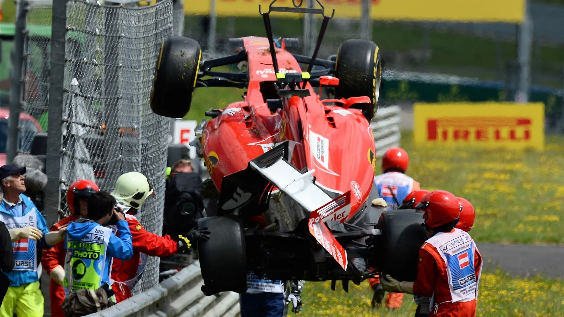 The crashed car of Kimi Raikkonen (FIN) Ferrari SF15-T is recovered  at Formula One World Championship, Rd8, Austrian Grand Prix, Race, Spielberg, Austria, Sunday 21 June 2015. © Sutton Motorsport Images