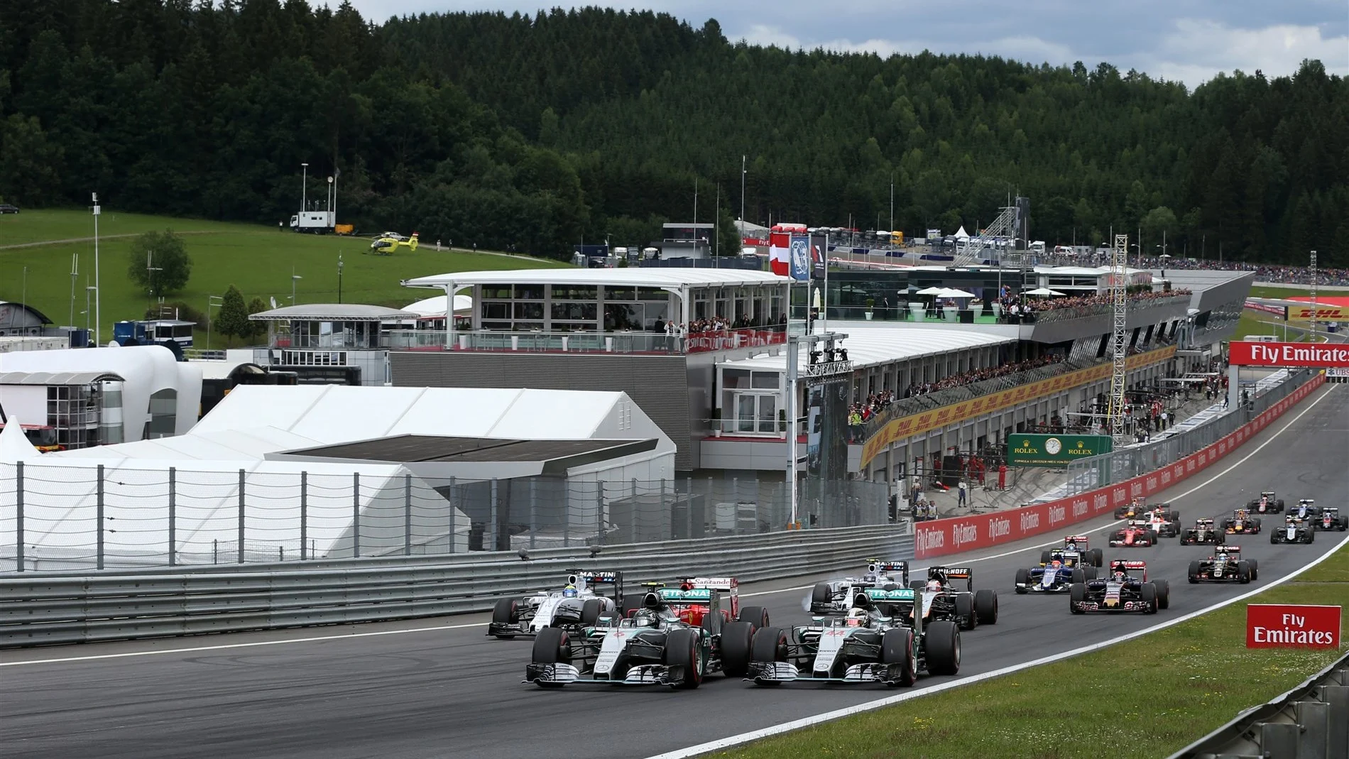 Nico Rosberg (GER) Mercedes AMG F1 W06 and Lewis Hamilton (GBR) Mercedes AMG F1 W06 at the start of the race at Formula One World Championship, Rd8, Austrian Grand Prix, Race, Spielberg, Austria, Sunday 21 June 2015. © Sutton Motorsport Images