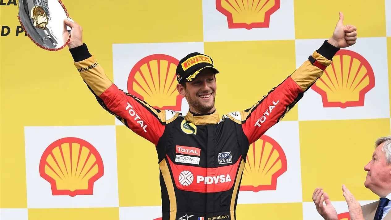 Third placed Romain Grosjean (FRA) Lotus F1 celebrates on the podium with the trophy at Formula One