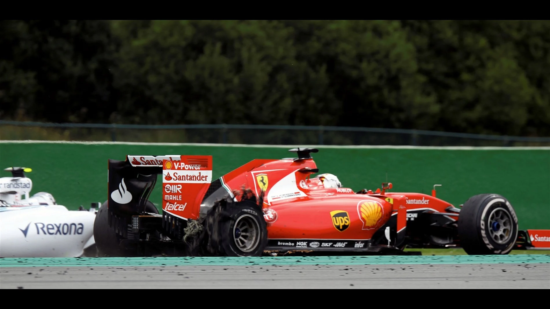 Sebastian Vettel (GER) Ferrari SF15-T with rear puncture at Formula One World Championship, Rd11,