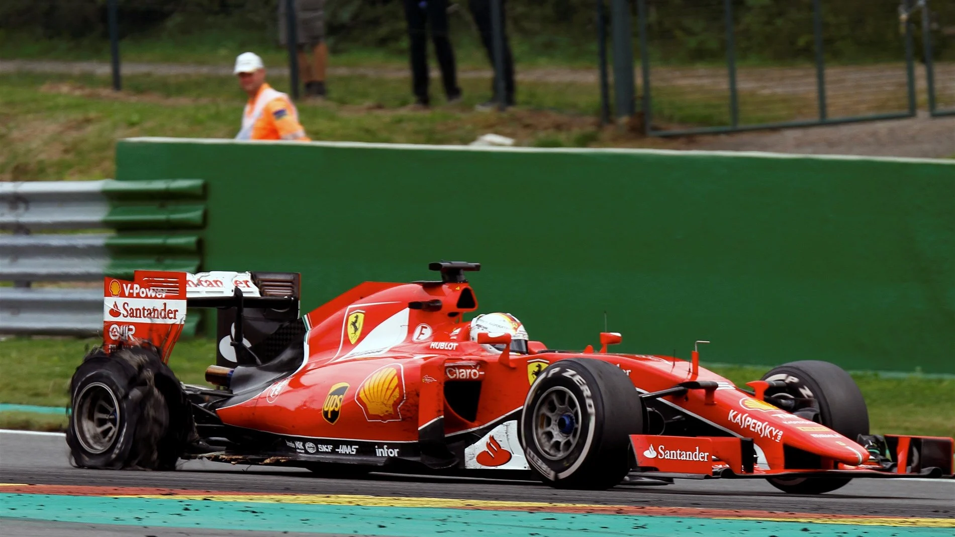 Sebastian Vettel (GER) Ferrari SF15-T with rear puncture at Formula One World Championship, Rd11, Belgian Grand Prix, Race, Spa Francorchamps, Belgium, Sunday 23 August 2015. © Sutton Motorsport Images
