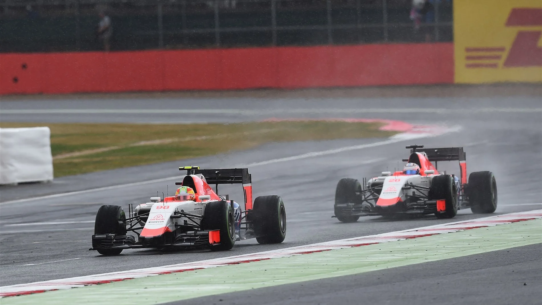 Will Stevens (GBR) Manor GP and Roberto Merhi (ESP) Manor GP battle for position at Formula One