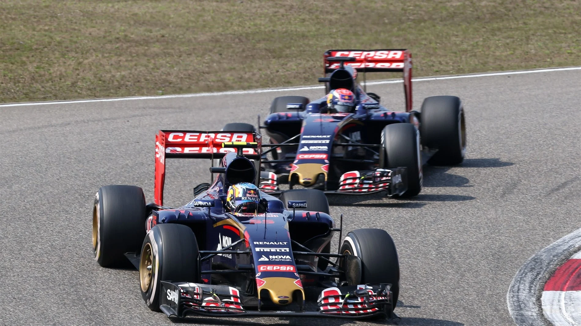Carlos Sainz (ESP) Scuderia Toro Rosso STR10 leading Max Verstappen (NDL) Scuderia Toro Rosso STR10 at Formula One World Championship, Rd3, Chinese Grand Prix, Race, Shanghai, China, Sunday 12 April 2015. © Sutton Motorsport Images