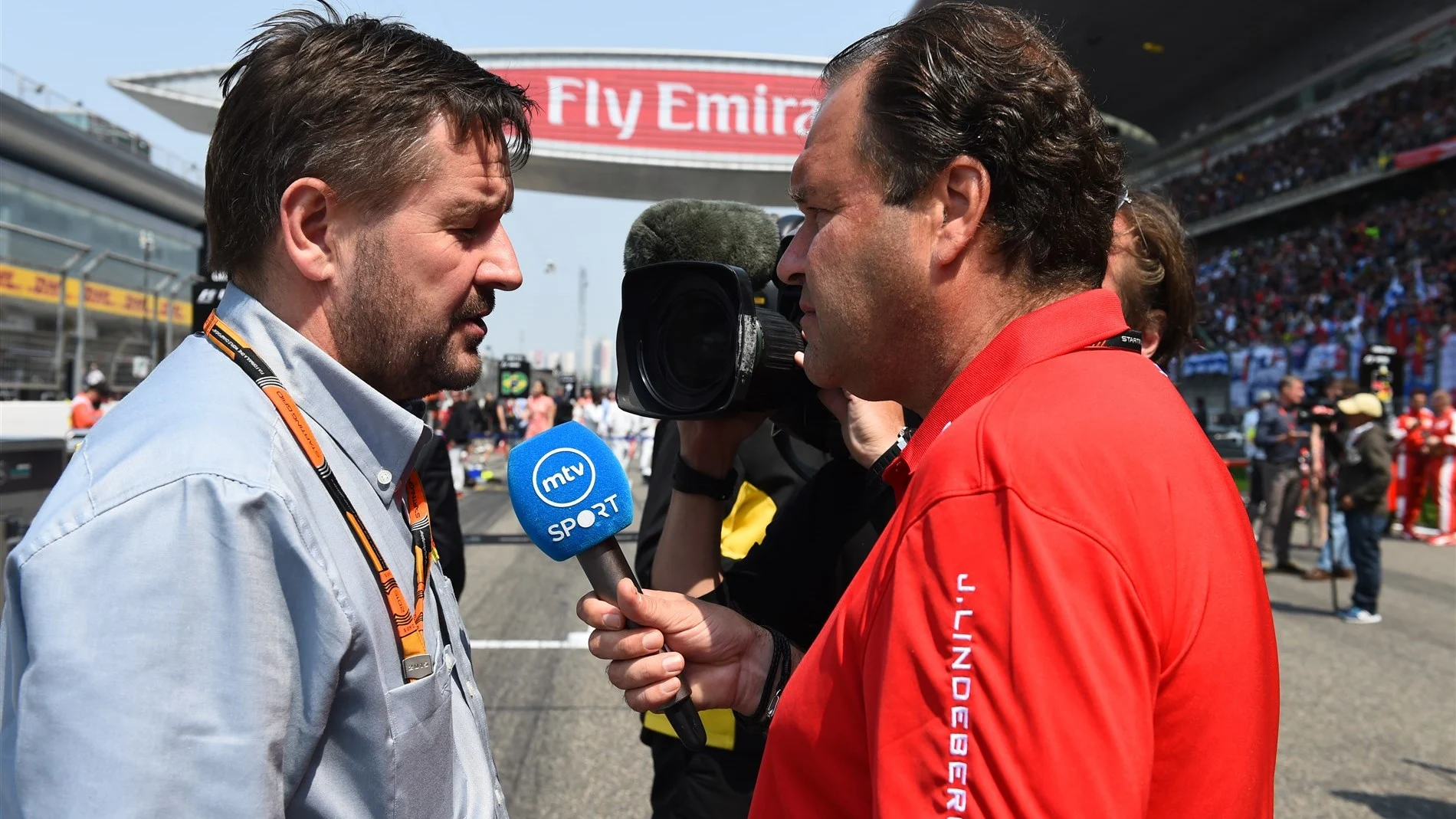 Paul Hembery (GBR) Pirelli Motorsport Director being interviewed by MTV Sport Finland on the grid
