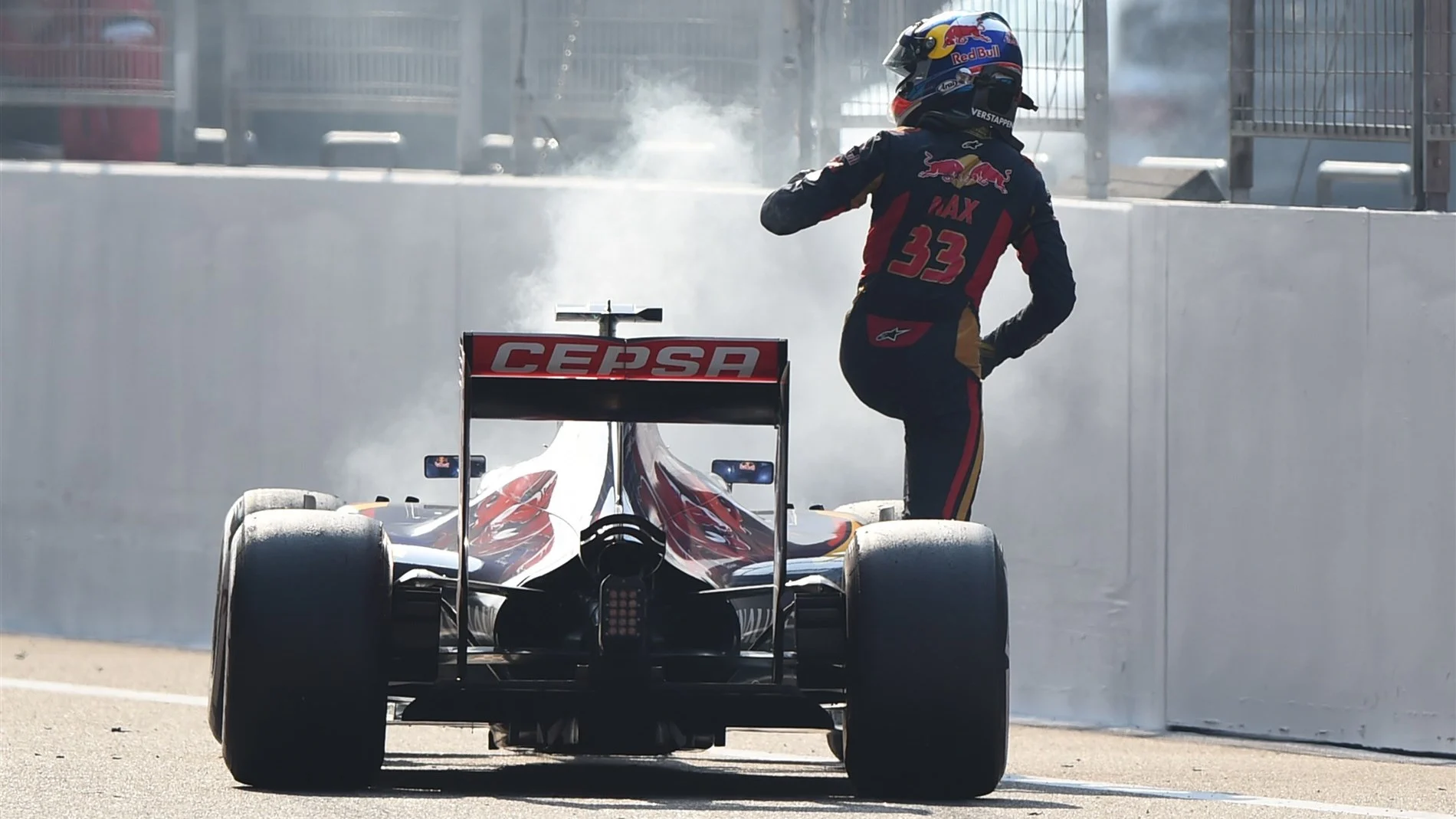 Max Verstappen (NDL) Scuderia Toro Rosso STR10 climbs out of his stricken car after blowing his