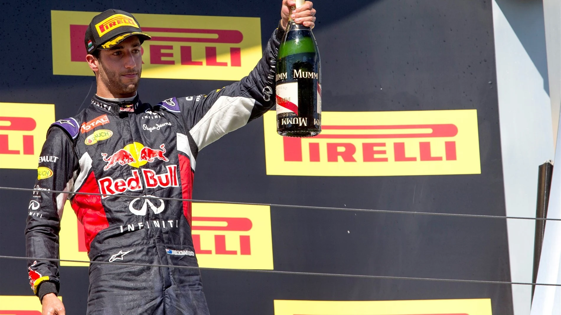 Daniel Ricciardo (AUS) Red Bull Racing celebrates on the podium with champagne at Formula One World