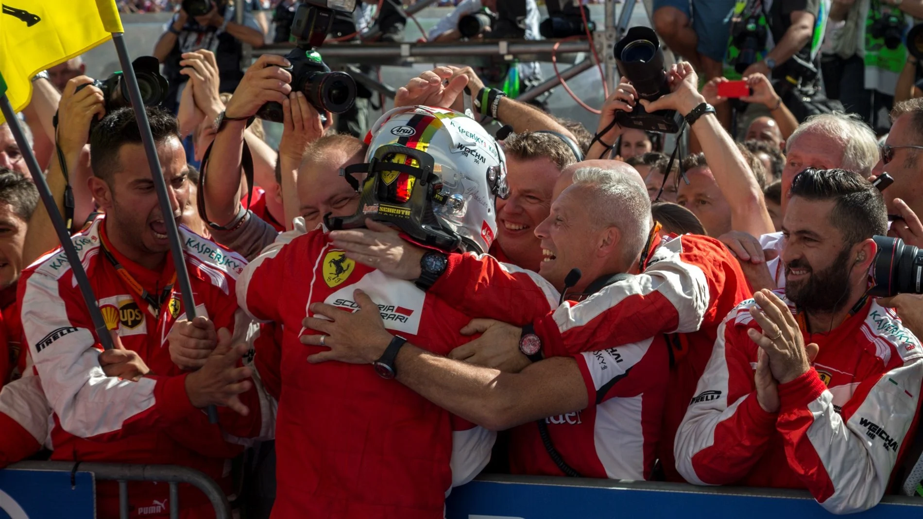 Race winner Sebastian Vettel (GER) Ferrari celebrates with the team in parc ferme at Formula One World Championship, Rd10, Hungarian Grand Prix, Race, Hungaroring, Hungary, Sunday 26 July 2015. © Sutton Motorsport Images