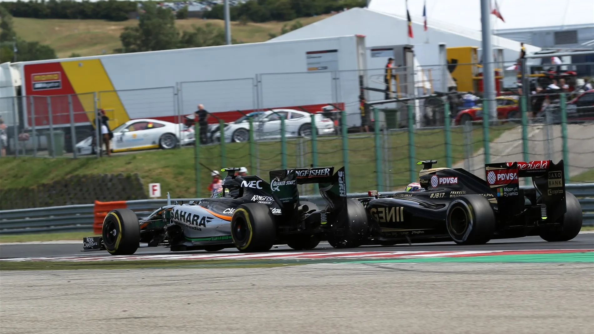 Sergio Perez (MEX) Force India VJM08 amd Pastor Maldonado (VEN) Lotus E23 Hybrid collide at Formula
