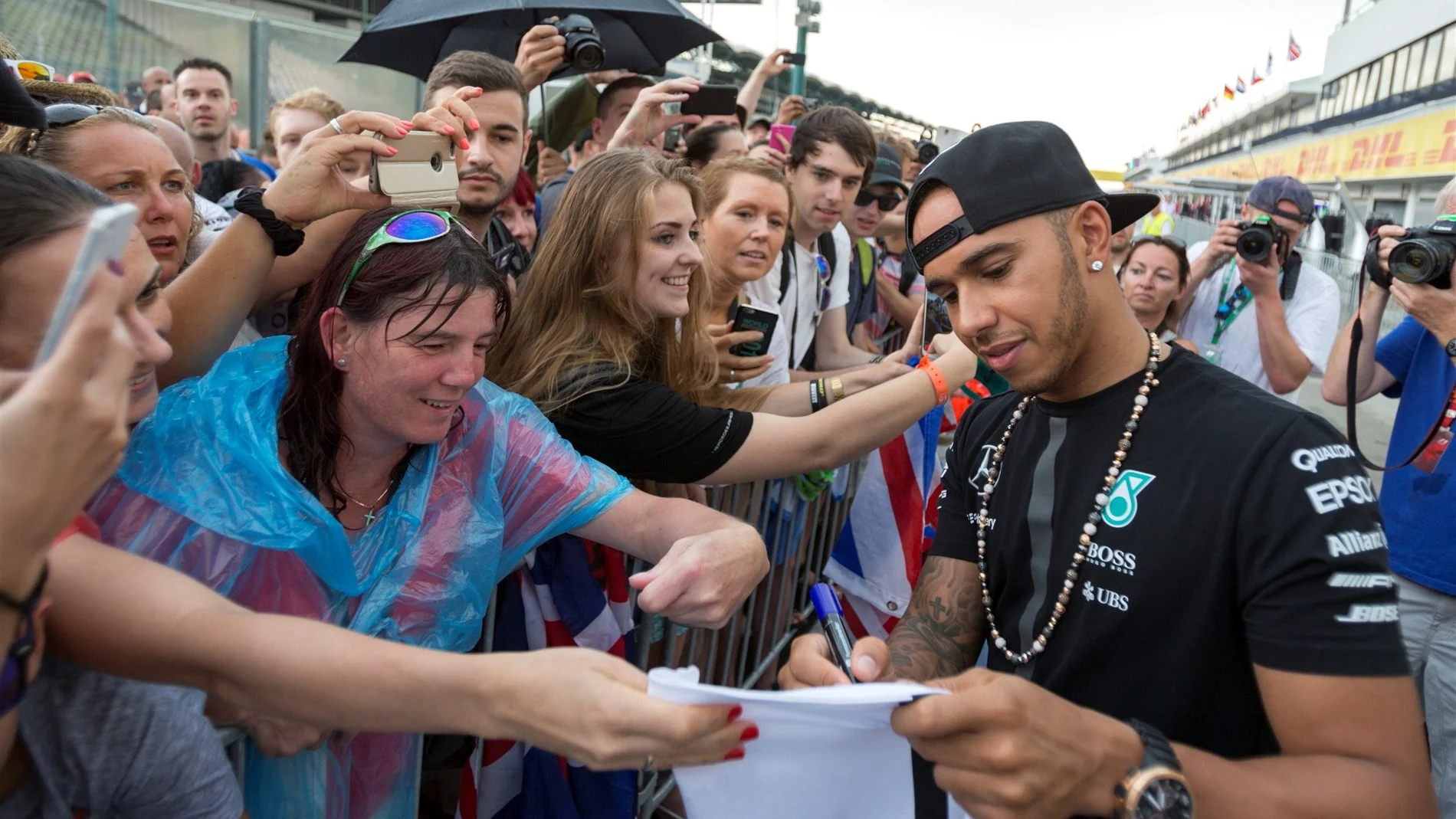 Lewis Hamilton (GBR) Mercedes AMG F1 signs autographs for the fans at Formula One World