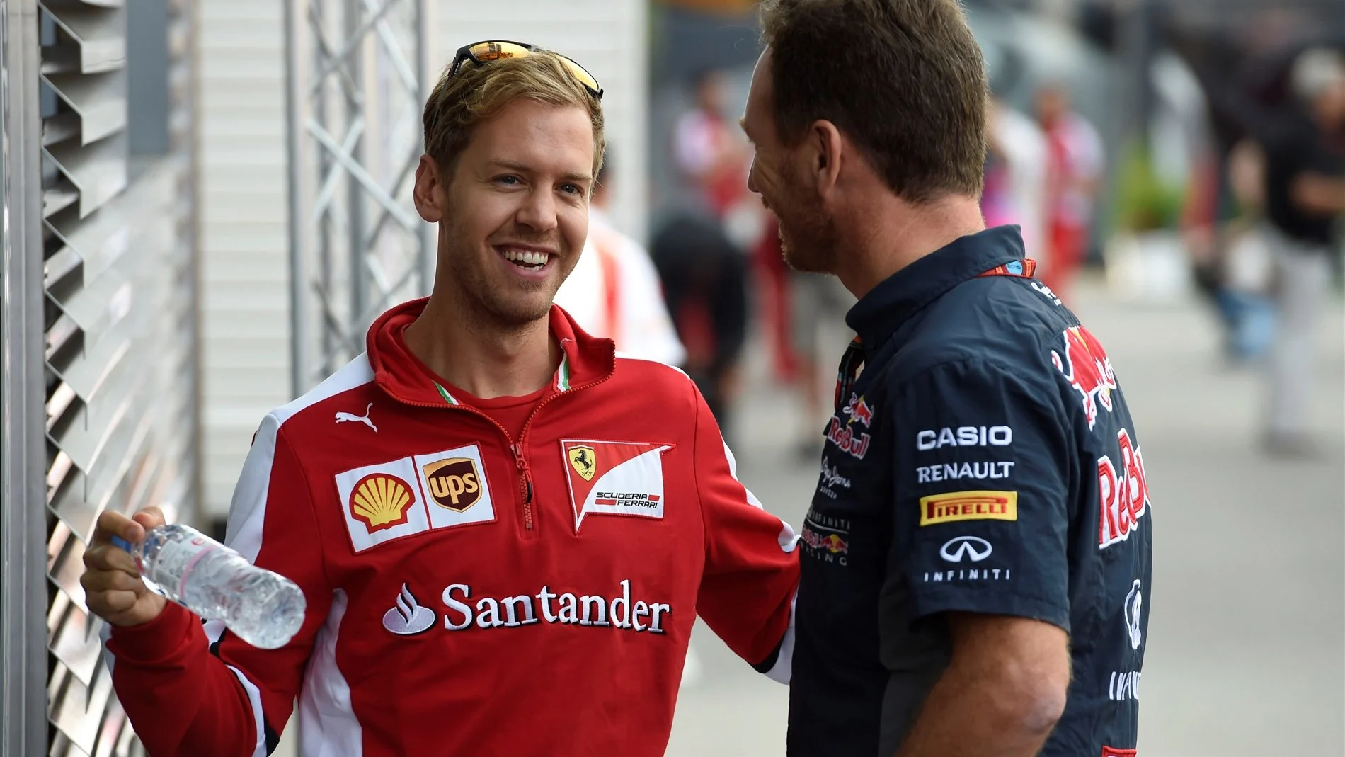 Sebastian Vettel (GER) Ferrari talks with Christian Horner (GBR) Red Bull Racing Team Principal at