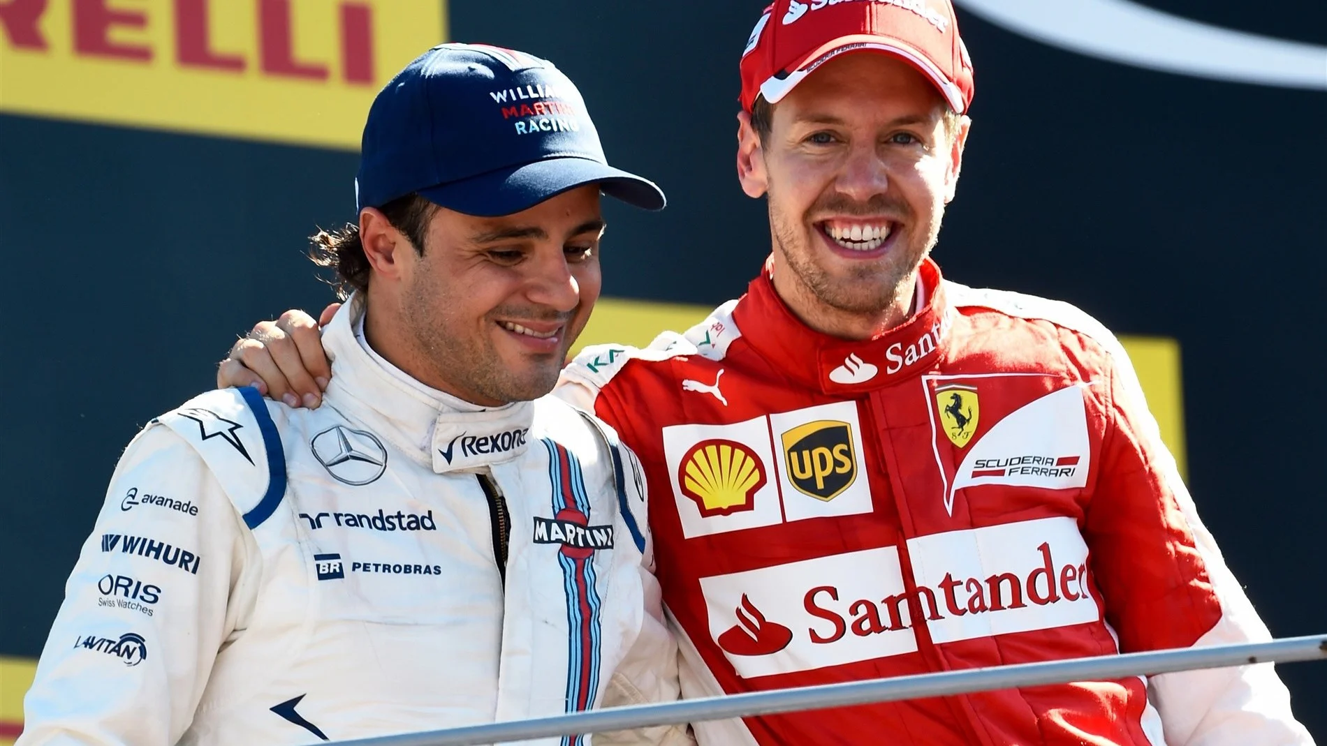 Sebastian Vettel (GER) Ferrari and Felipe Massa (BRA) Williams celebrate on the podium at Formula