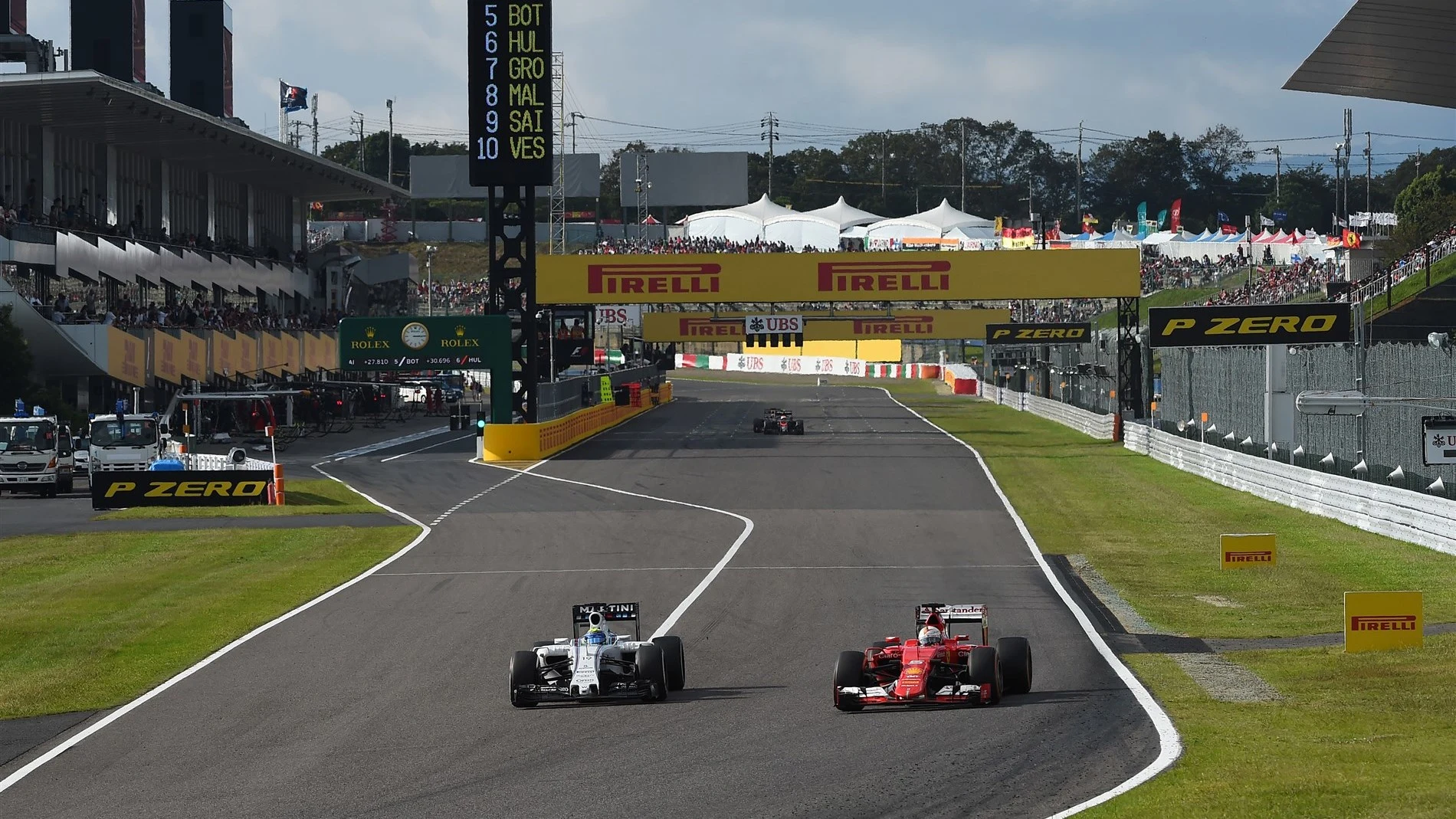 Felipe Massa (BRA) Williams FW37 and Sebastian Vettel (GER) Ferrari SF15-T at Formula One World