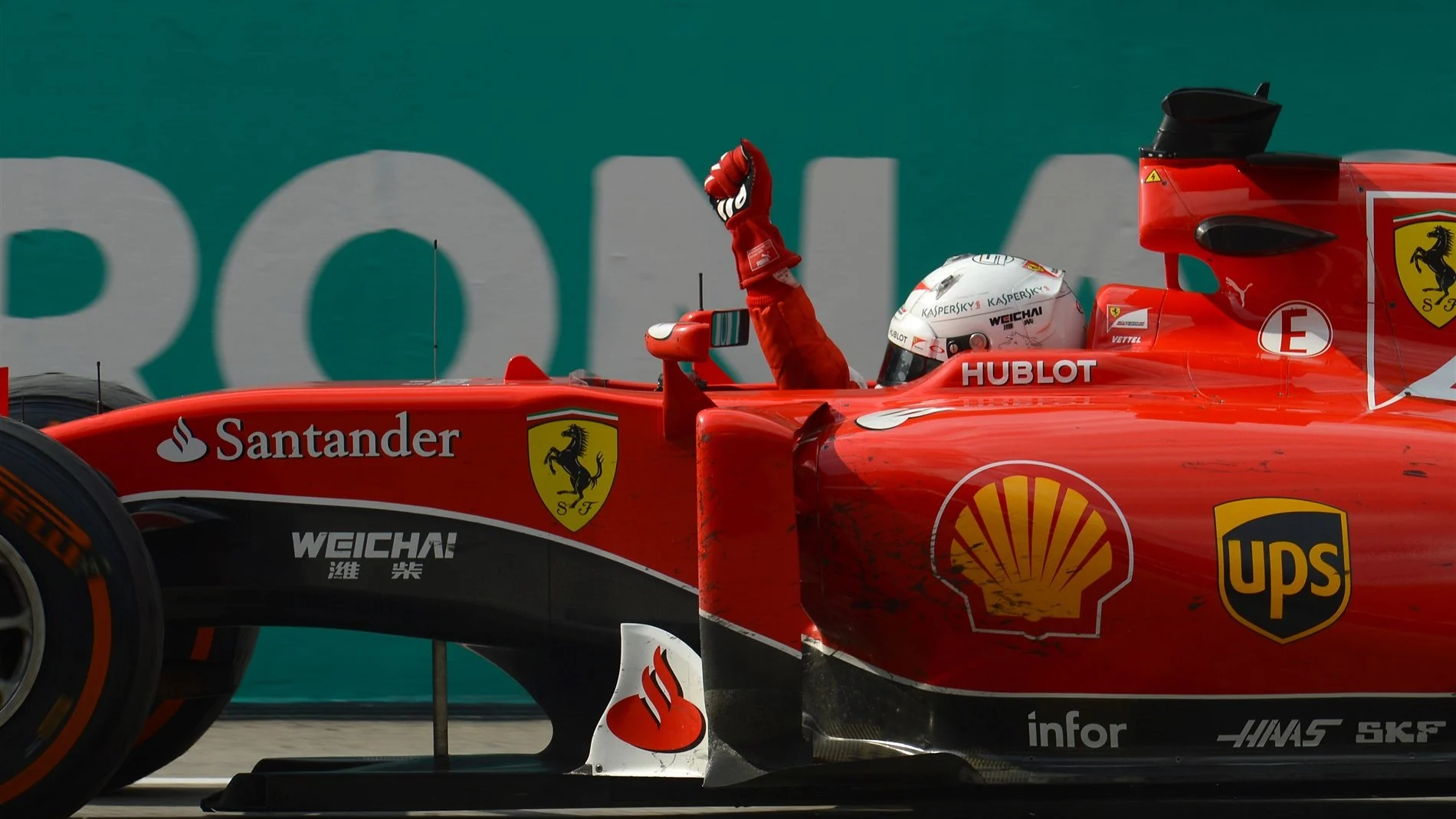 Race winner Sebastian Vettel (GER) Ferrari SF15-T crosses the line Formula One World Championship,