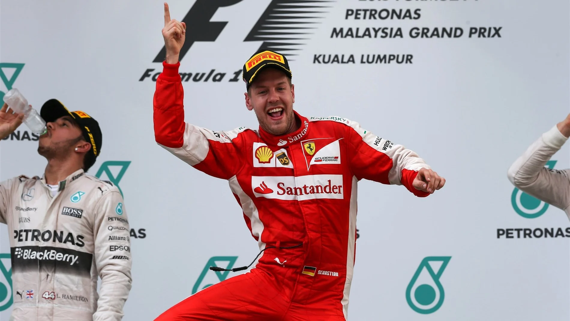 Race winner Sebastian Vettel (GER) Ferrari celebrates on the podium at Formula One World Championship, Rd2, Malaysian Grand Prix, Race, Sepang, Malaysia, Sunday 29 March 2015. © Sutton Motorsport Images