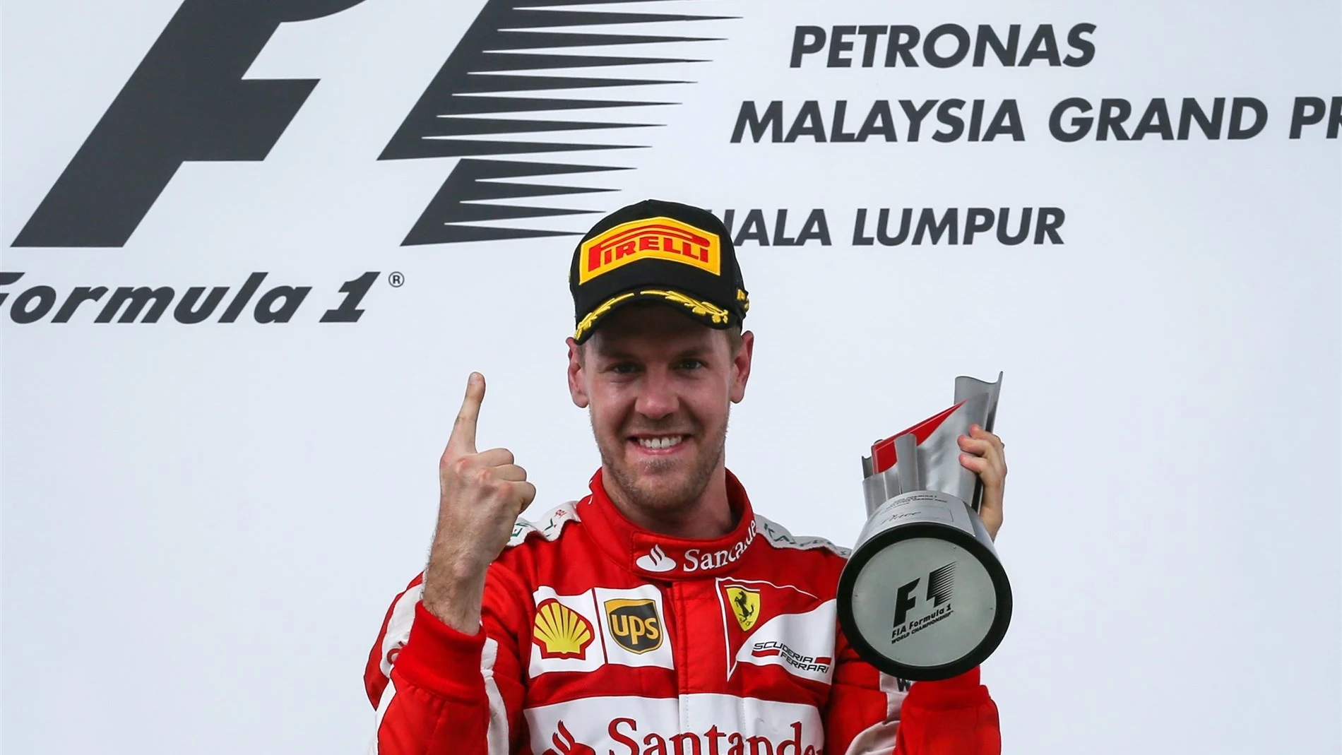 Race winner Sebastian Vettel (GER) Ferrari celebrates on the podium at Formula One World