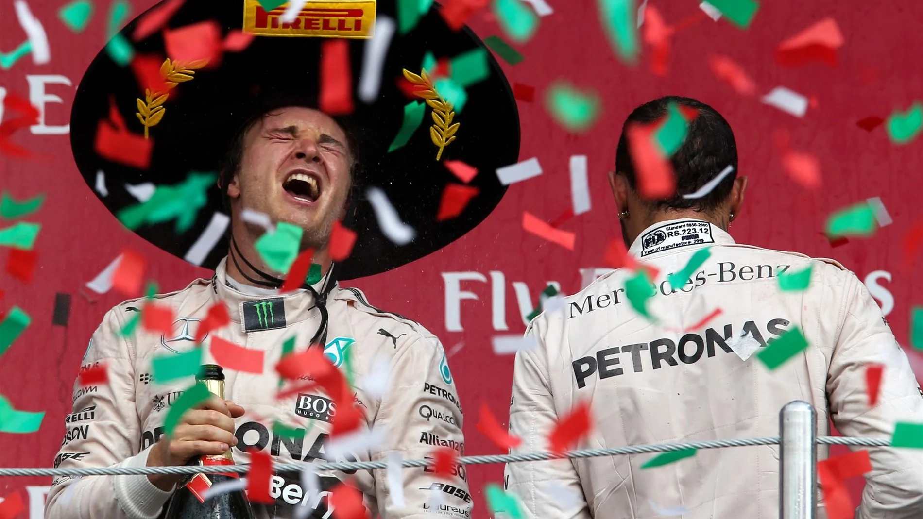 Race winner Nico Rosberg (GER) Mercedes AMG F1 celebrates on the podium with Lewis Hamilton (GBR)