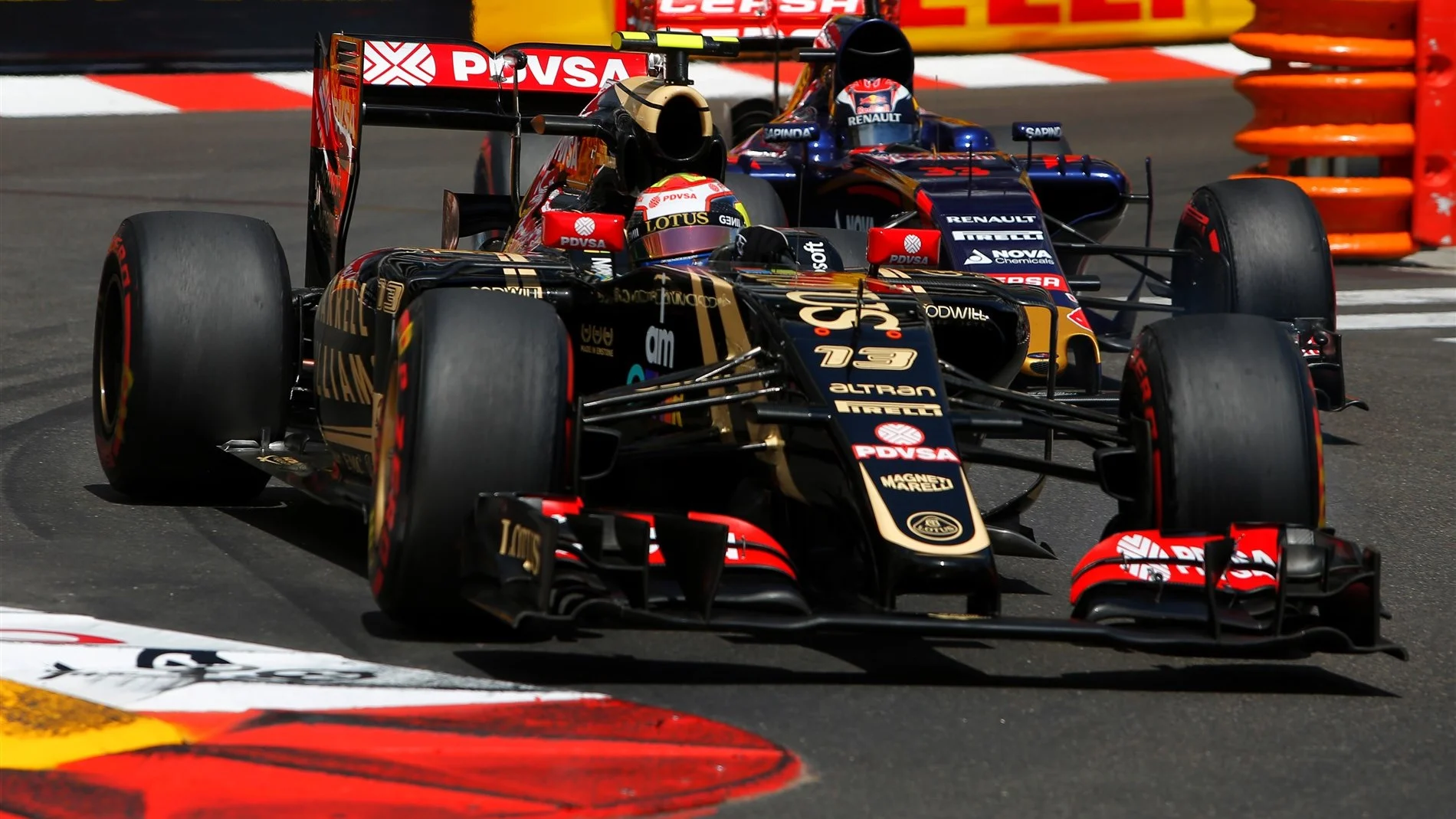 Pastor Maldonado (VEN) Lotus E23 Hybrid and Max Verstappen (NDL) Scuderia Toro Rosso STR10 at