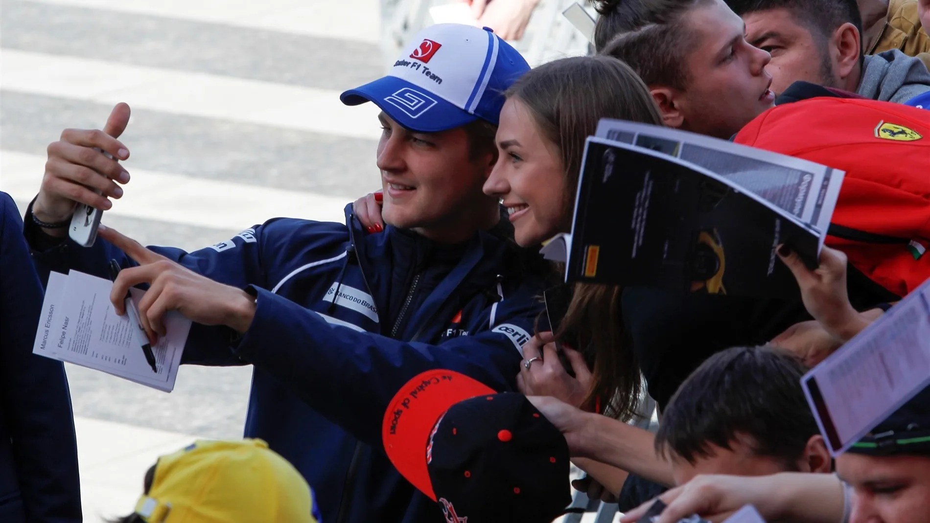 Marcus Ericsson (SWE) Sauber taking a selfie during the autograph session at Formula One World Championship, Rd15, Russian Grand Prix, Race, Sochi Autodrom, Sochi, Krasnodar Krai, Russia, Sunday 11 October 2015. © Sutton Motorsport Images