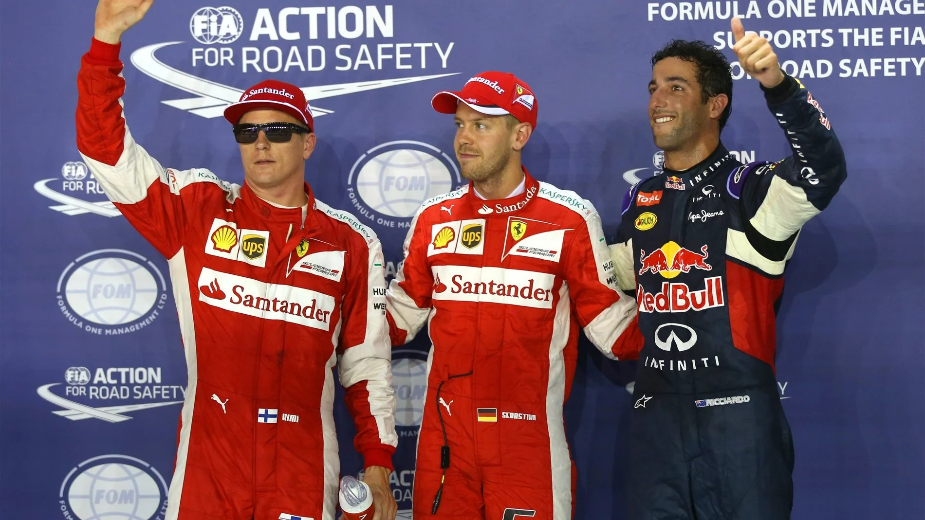 (L to R): Kimi Raikkonen (FIN) Ferrari, pole sitter Sebastian Vettel (GER) Ferrari and Daniel Ricciardo (AUS) Red Bull Racing celebrate in parc ferme at Formula One World Championship, Rd13, Singapore Grand Prix, Qualifying, Marina Bay Street Circuit, Singapore, Saturday 19  September 2015. © Sutton Motorsport Images