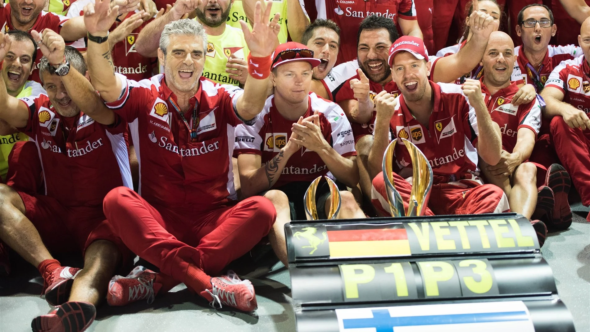 Kimi Raikkonen (FIN) Ferrari and race winner Sebastian Vettel (GER) Ferrari celebrate with Maurizio
