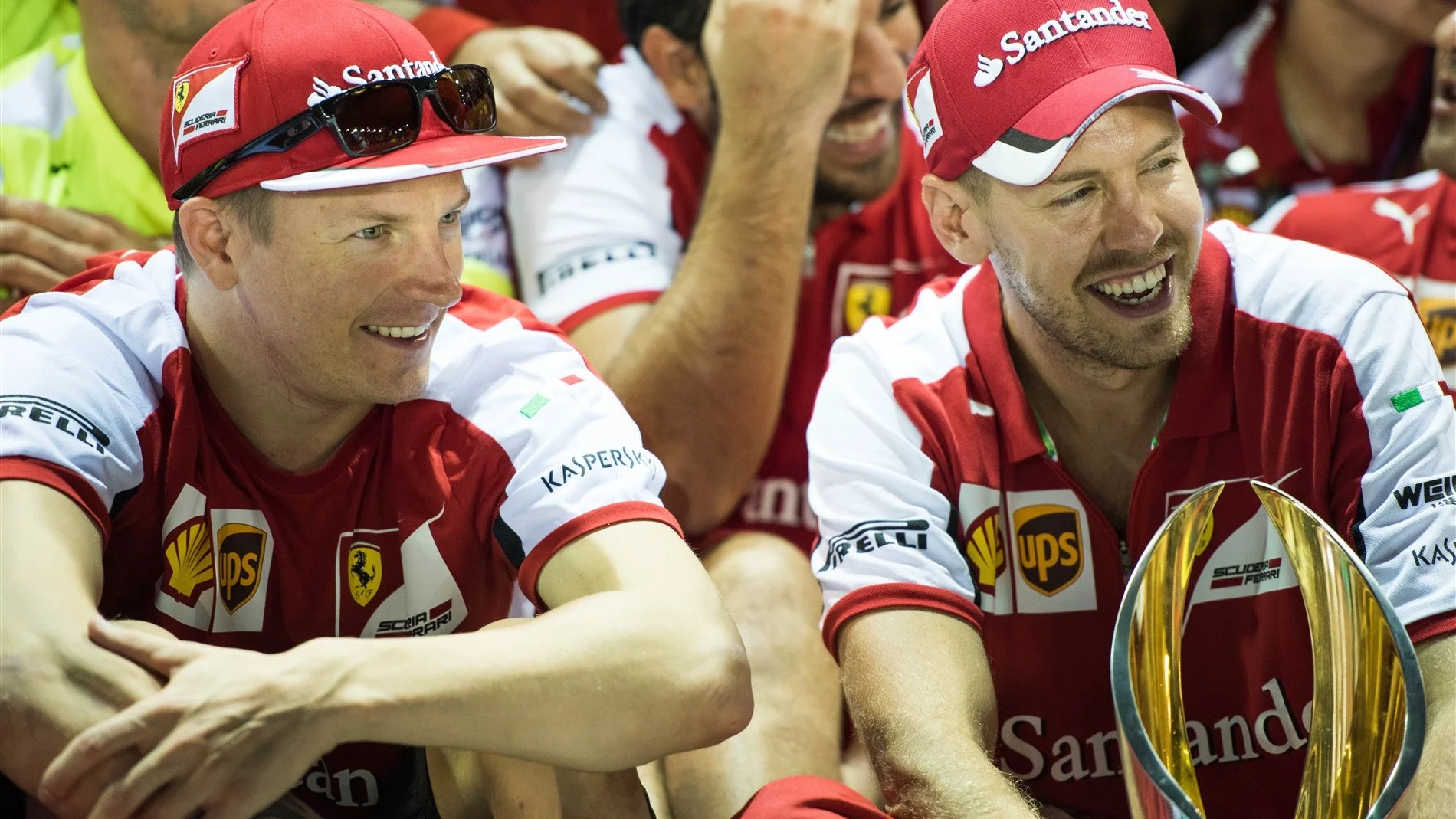 Kimi Raikkonen (FIN) Ferrari and race winner Sebastian Vettel (GER) Ferrari celebrate with the trophy at Formula One World Championship, Rd13, Singapore Grand Prix, Race, Marina Bay Street Circuit, Singapore, Sunday 20 September 2015. © Sutton Motorsport Images