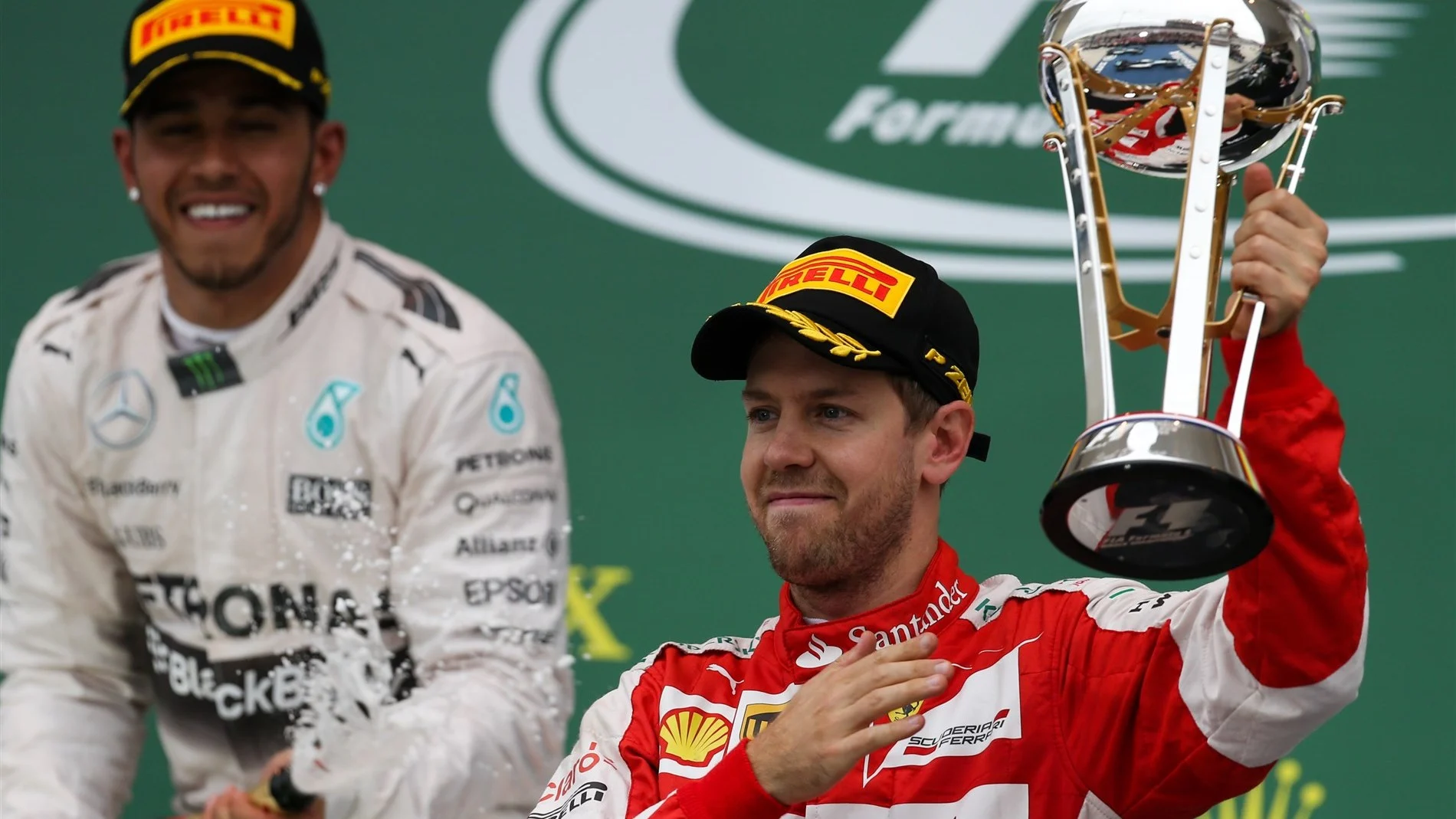 Sebastian Vettel (GER) Ferrari celebrates on the podium with the trophy at Formula One World