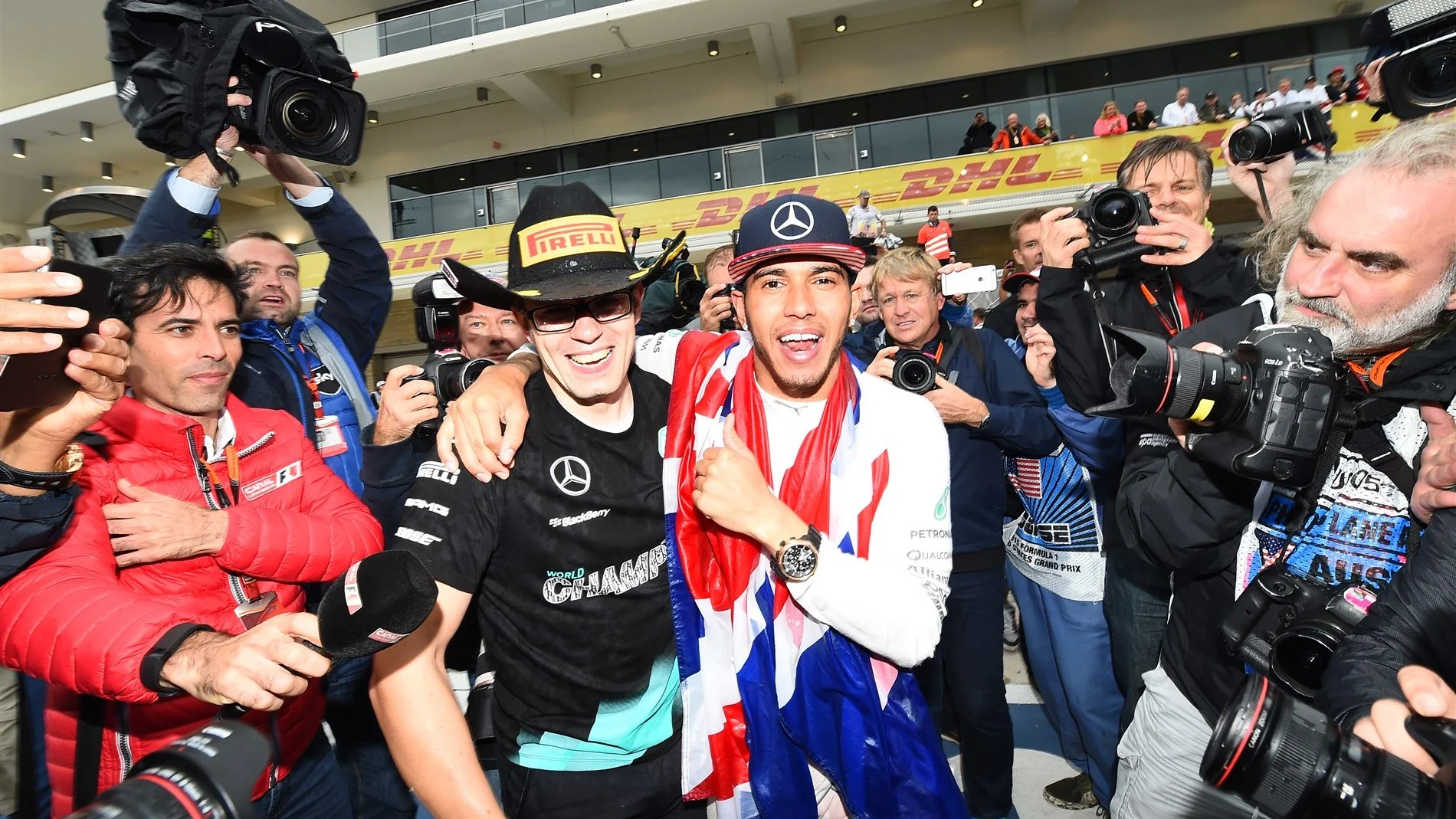 Race winner and new World Champion Lewis Hamilton (GBR) Mercedes AMG F1 celebrates with his ace