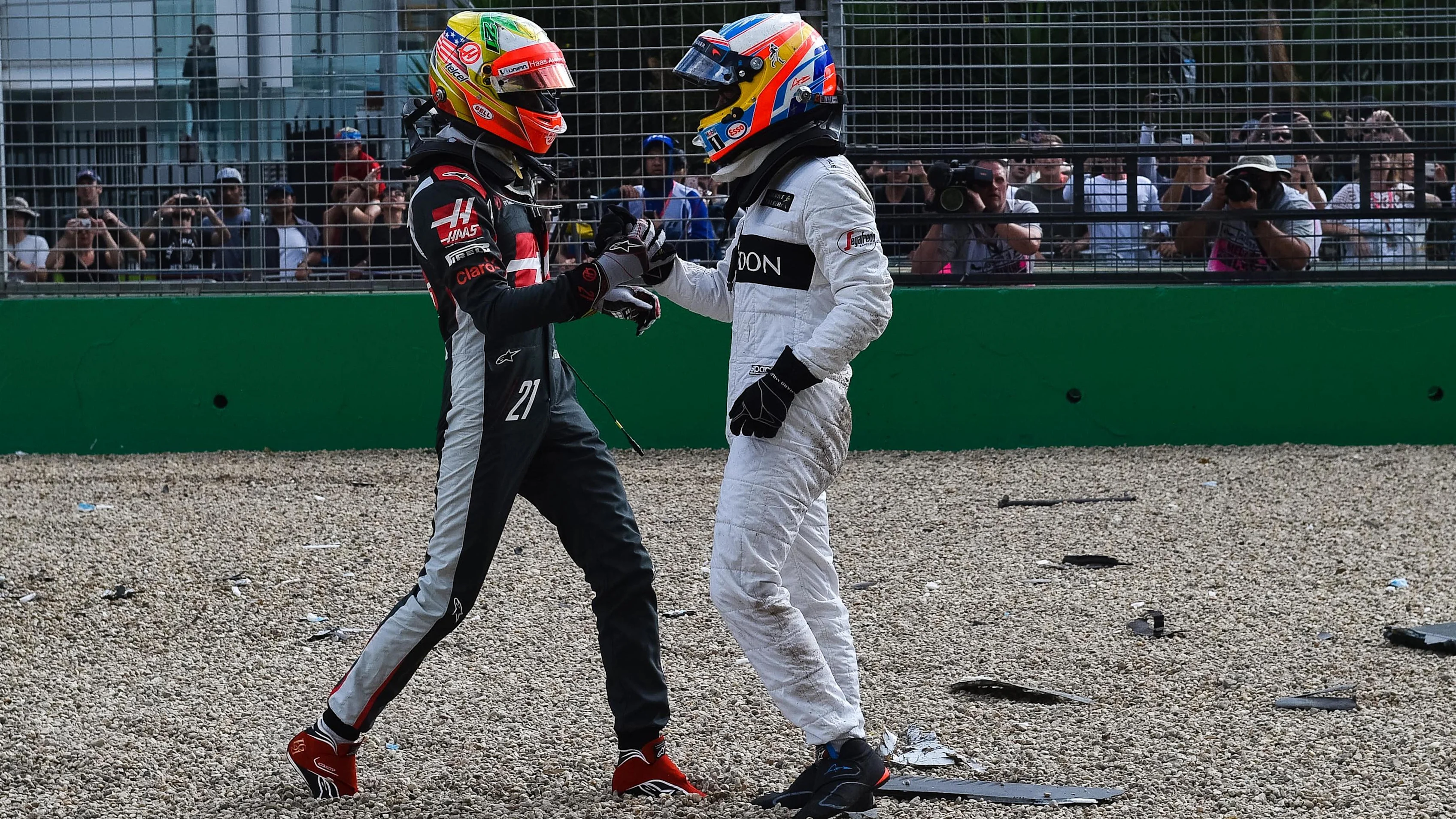 Fernando Alonso (ESP) McLaren and Esteban Gutierrez (MEX) Haas F1 crashed out of the race at