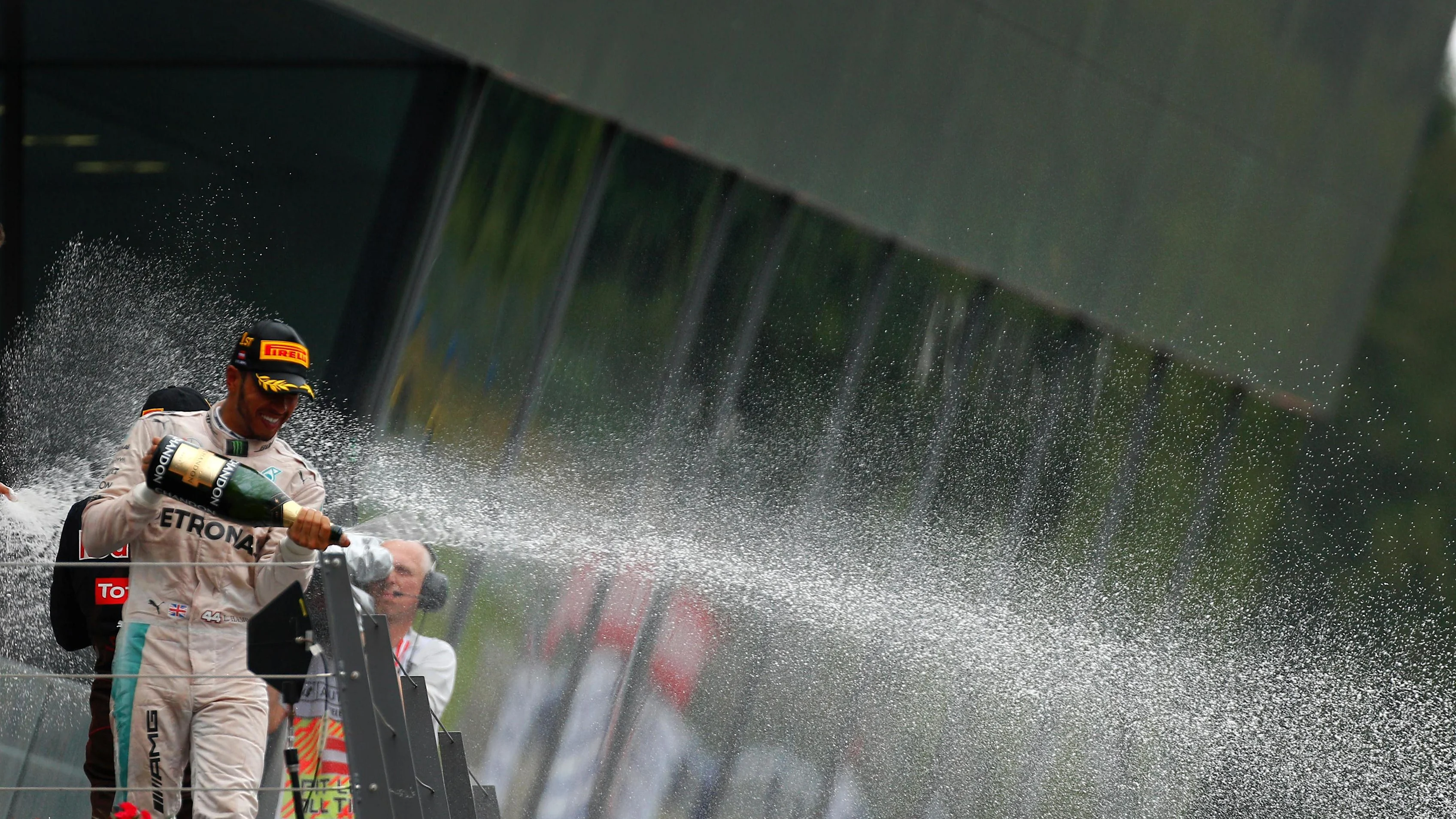 Lewis Hamilton (GBR) Mercedes AMG F1 celebrates on the podium with the champagne at Formula One