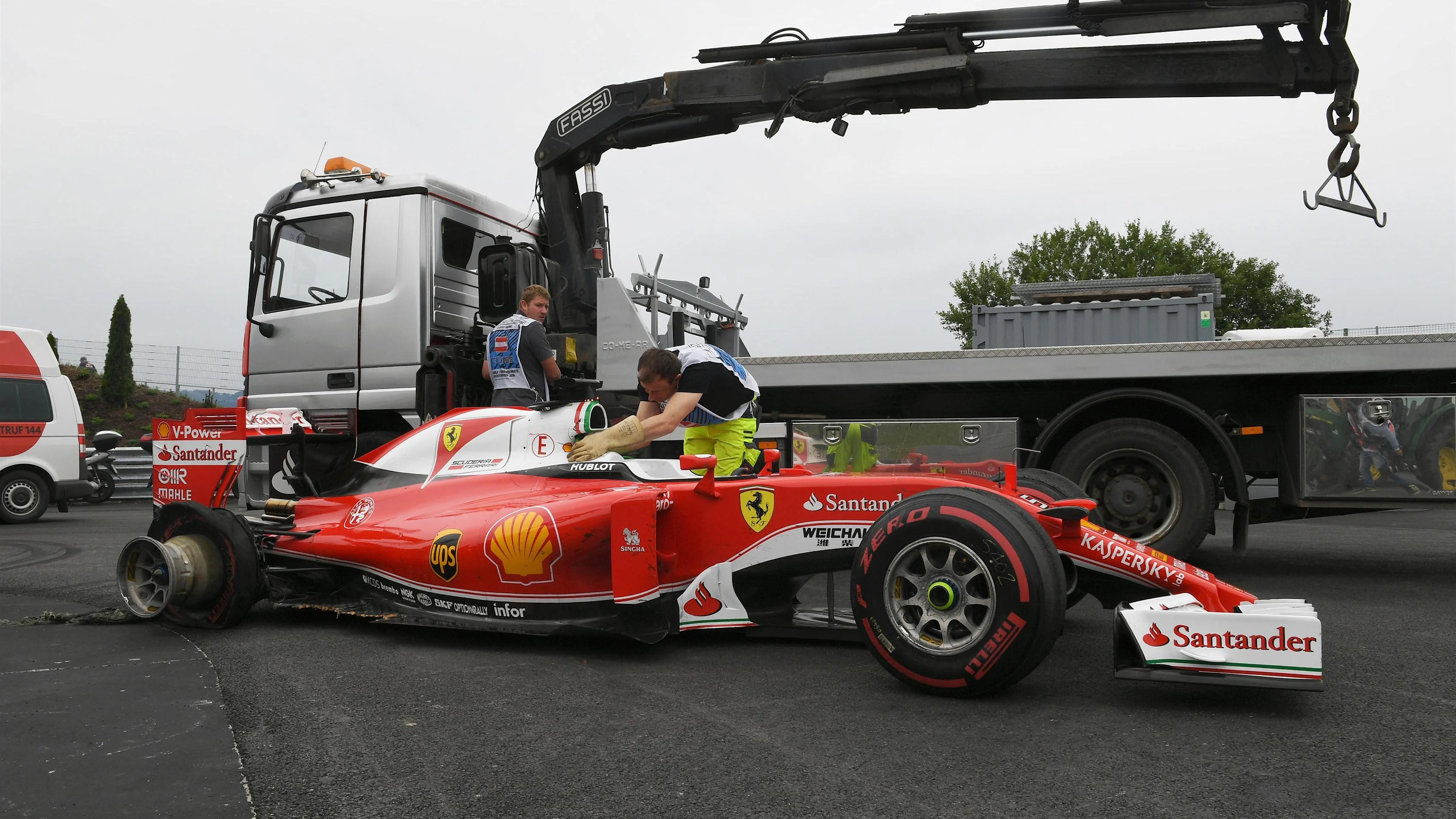 The crashed car of race retiree Sebastian Vettel (GER) Ferrari SF16-H is recovered at Formula One