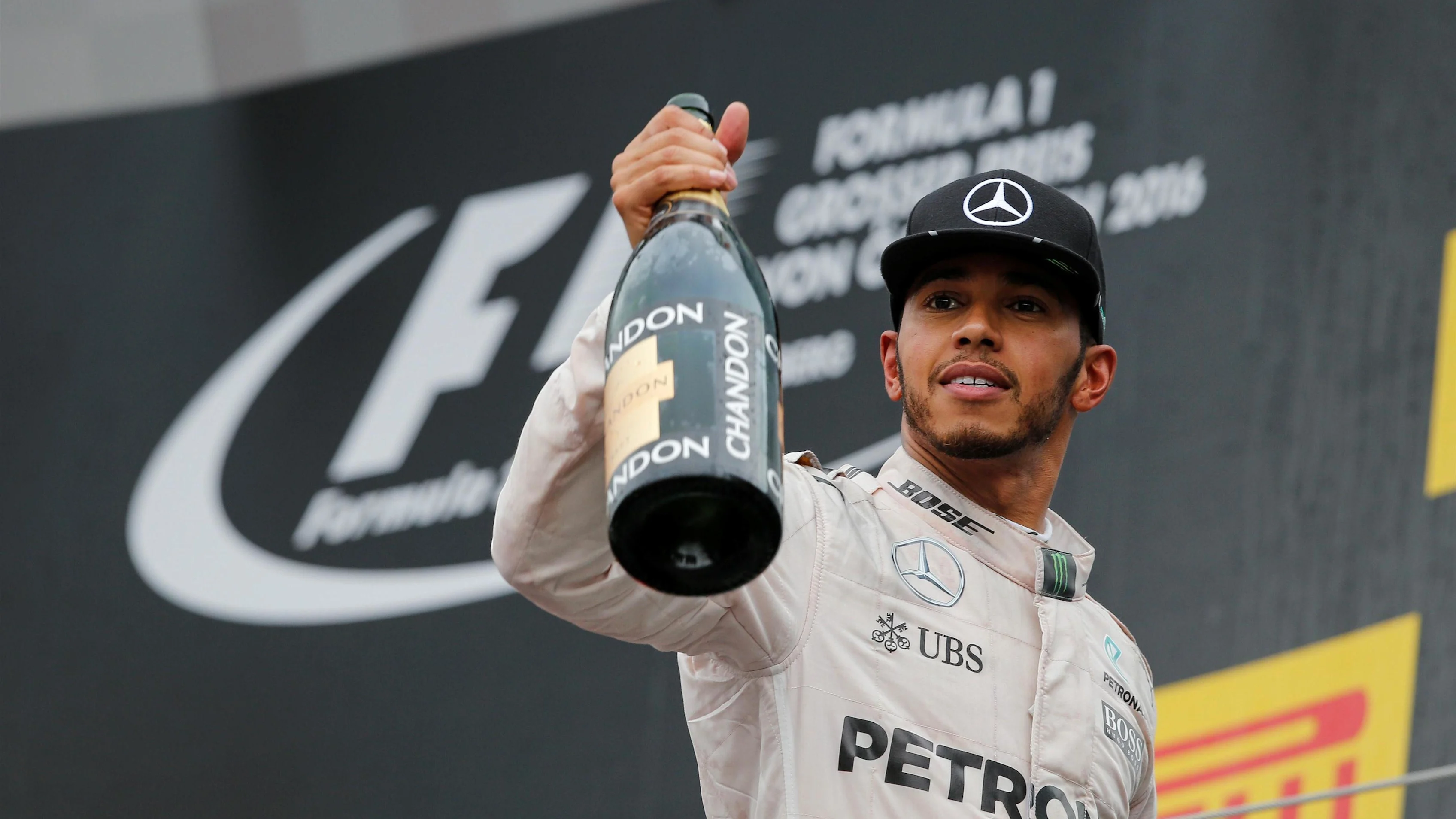 Race winner Lewis Hamilton (GBR) Mercedes AMG F1 celebrates on the podium with the champagne at