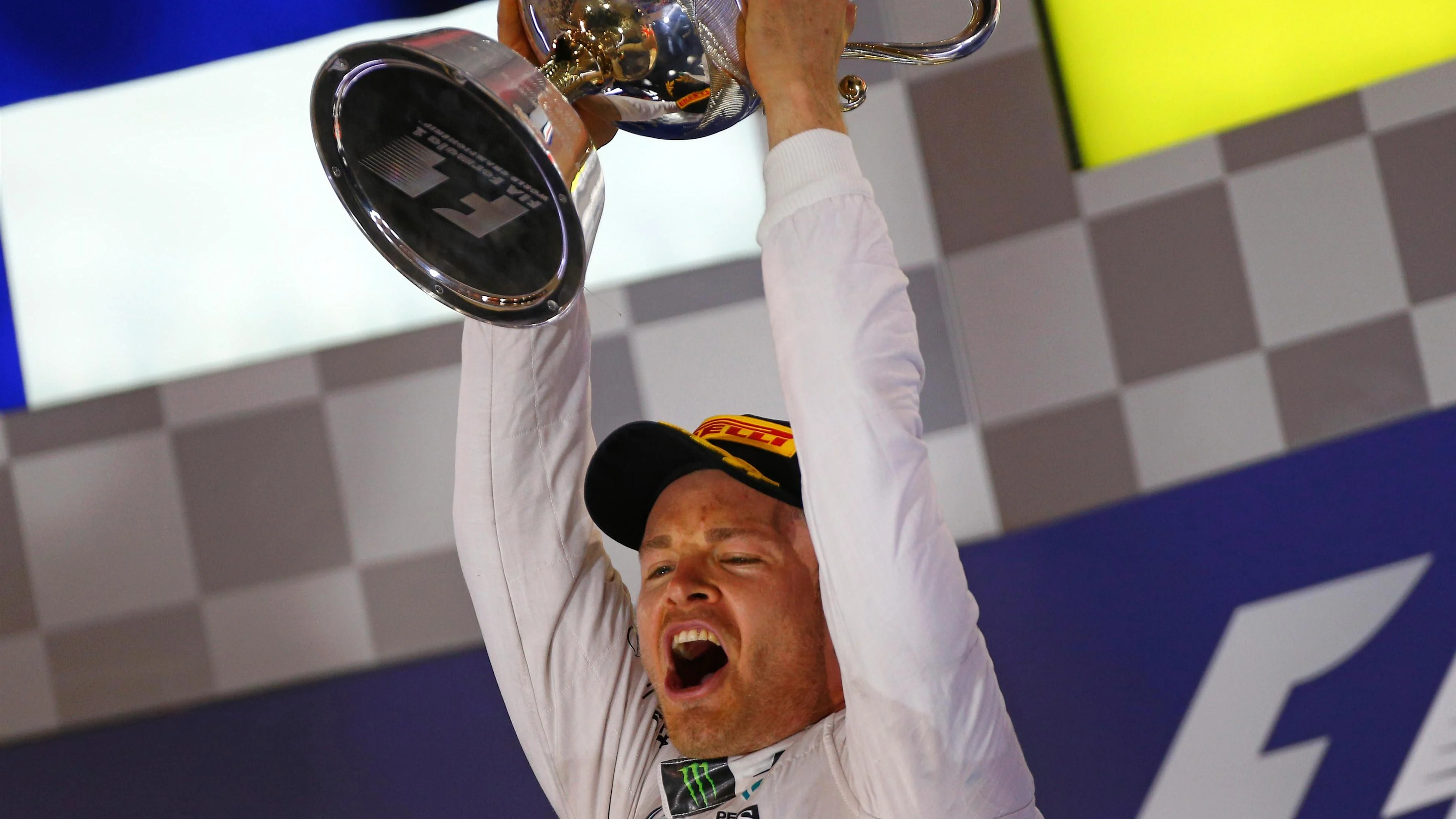 Nico Rosberg (GER) Mercedes AMG F1 celebrates on the podium with the trophy at Formula One World