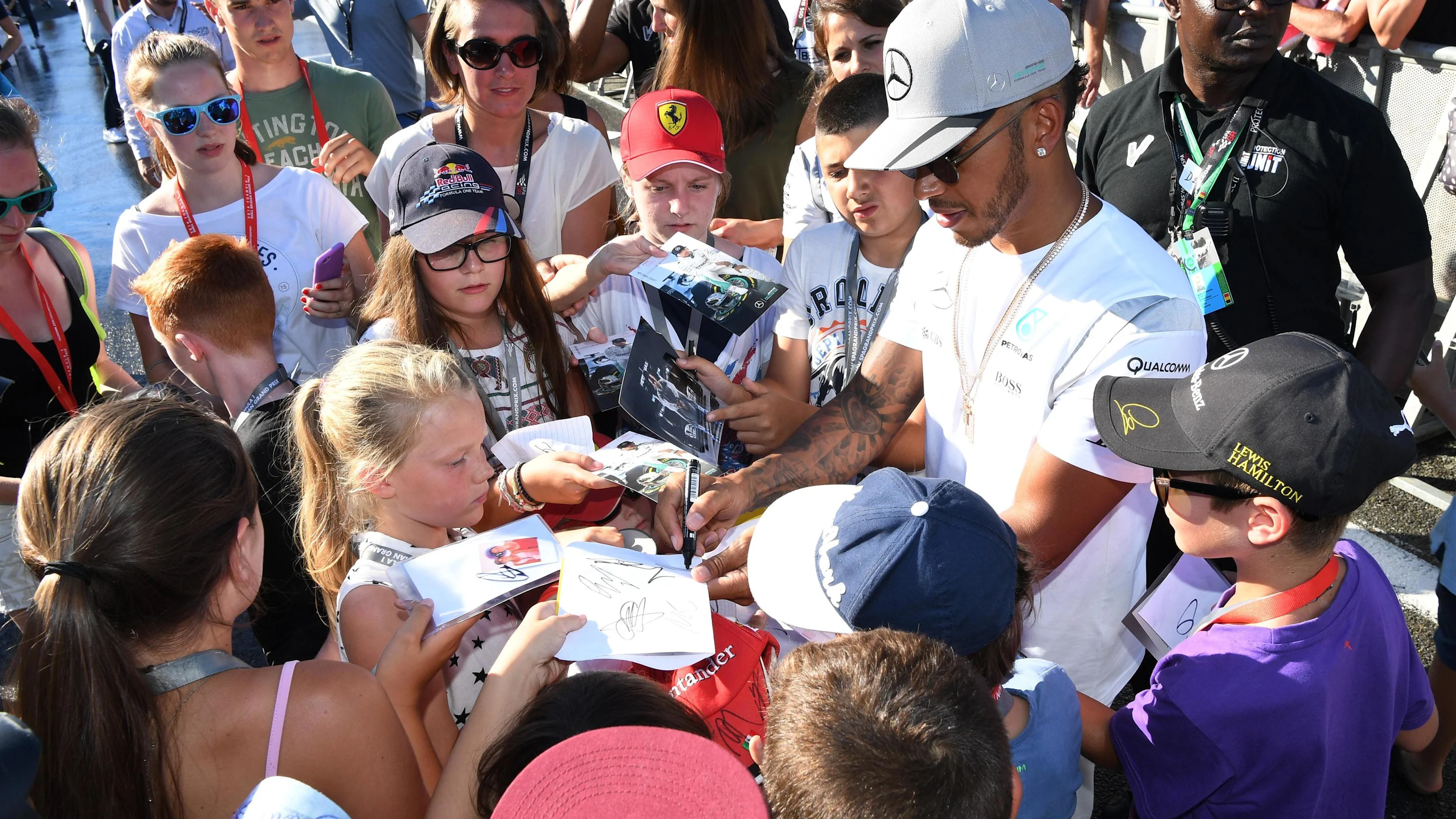 Lewis Hamilton (GBR) Mercedes AMG F1 signs autographs for the fans at Formula One World