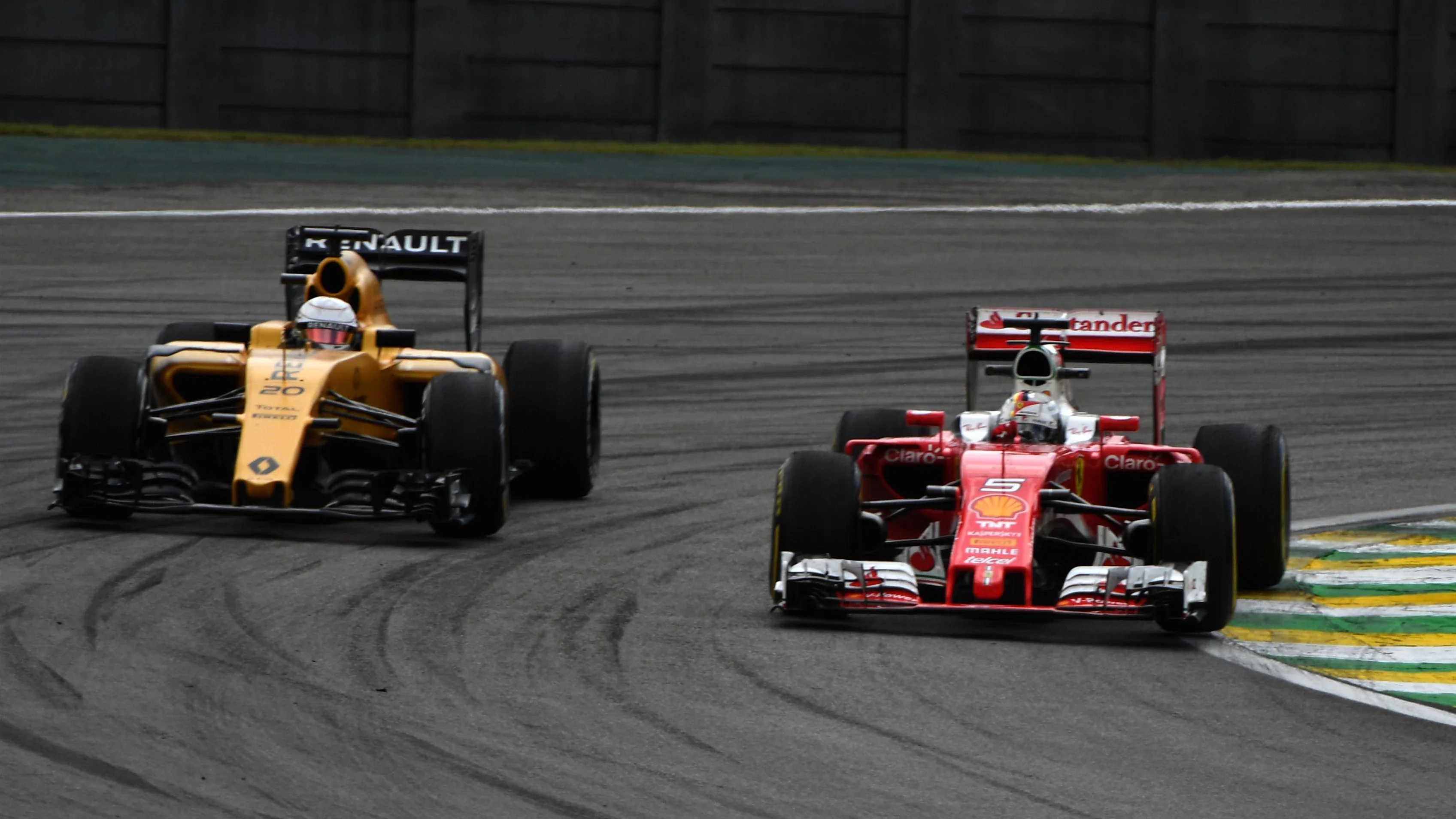 Kevin Magnussen (DEN) Renault Sport F1 Team RS16 and Sebastian Vettel (GER) Ferrari SF16-H at Formula One World Championship, Rd20, Brazilian Grand Prix, Practice, Interlagos, Sao Paulo, Brazil, Friday 11 November 2016. © Sutton Images