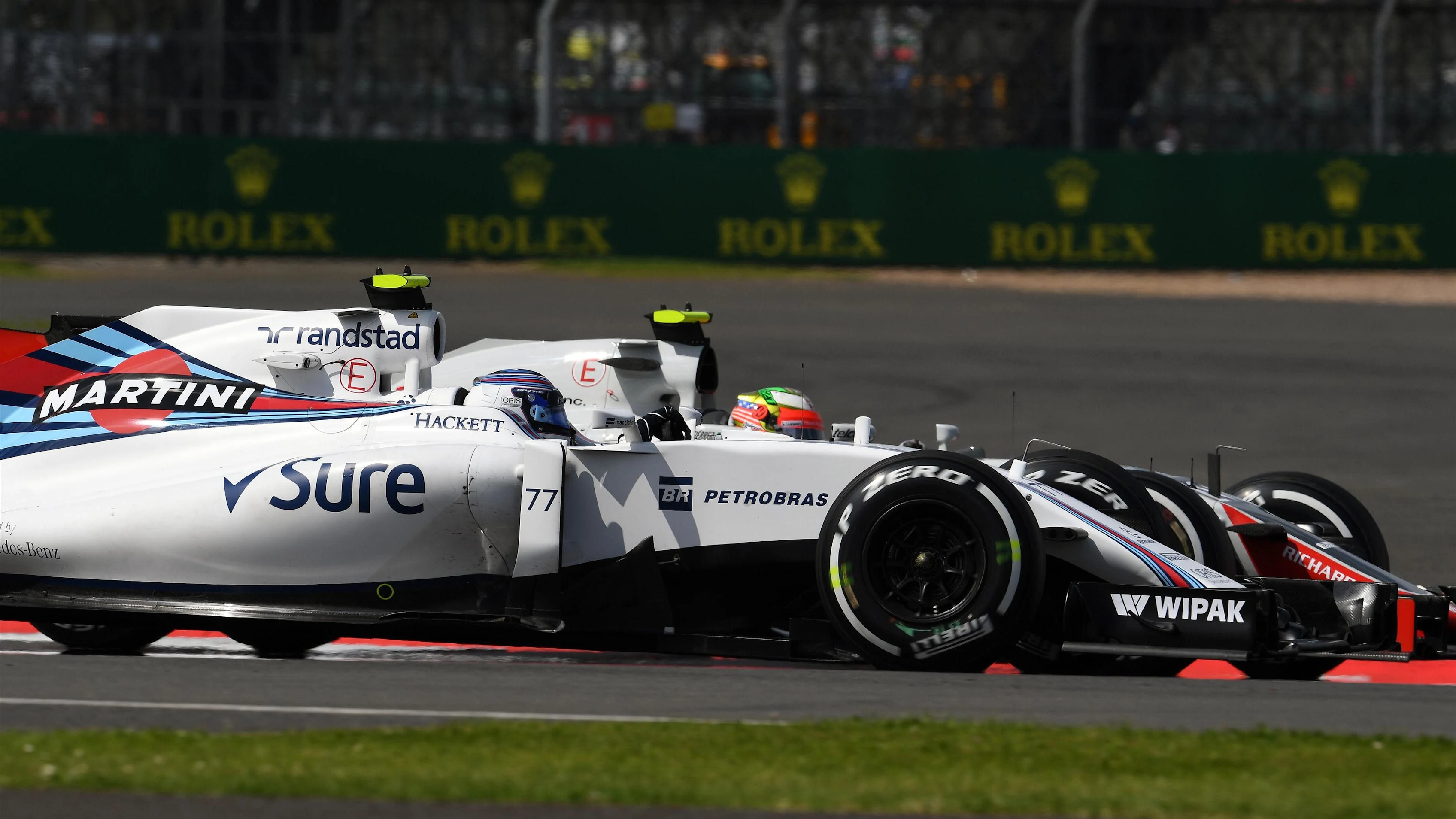 Valtteri Bottas (FIN) Williams FW38 and Esteban Gutierrez (MEX) Haas VF-16 at Formula One World Championship, Rd10, British Grand Prix, Practice, Silverstone, England, Friday 8 July 2016. © Sutton Images
