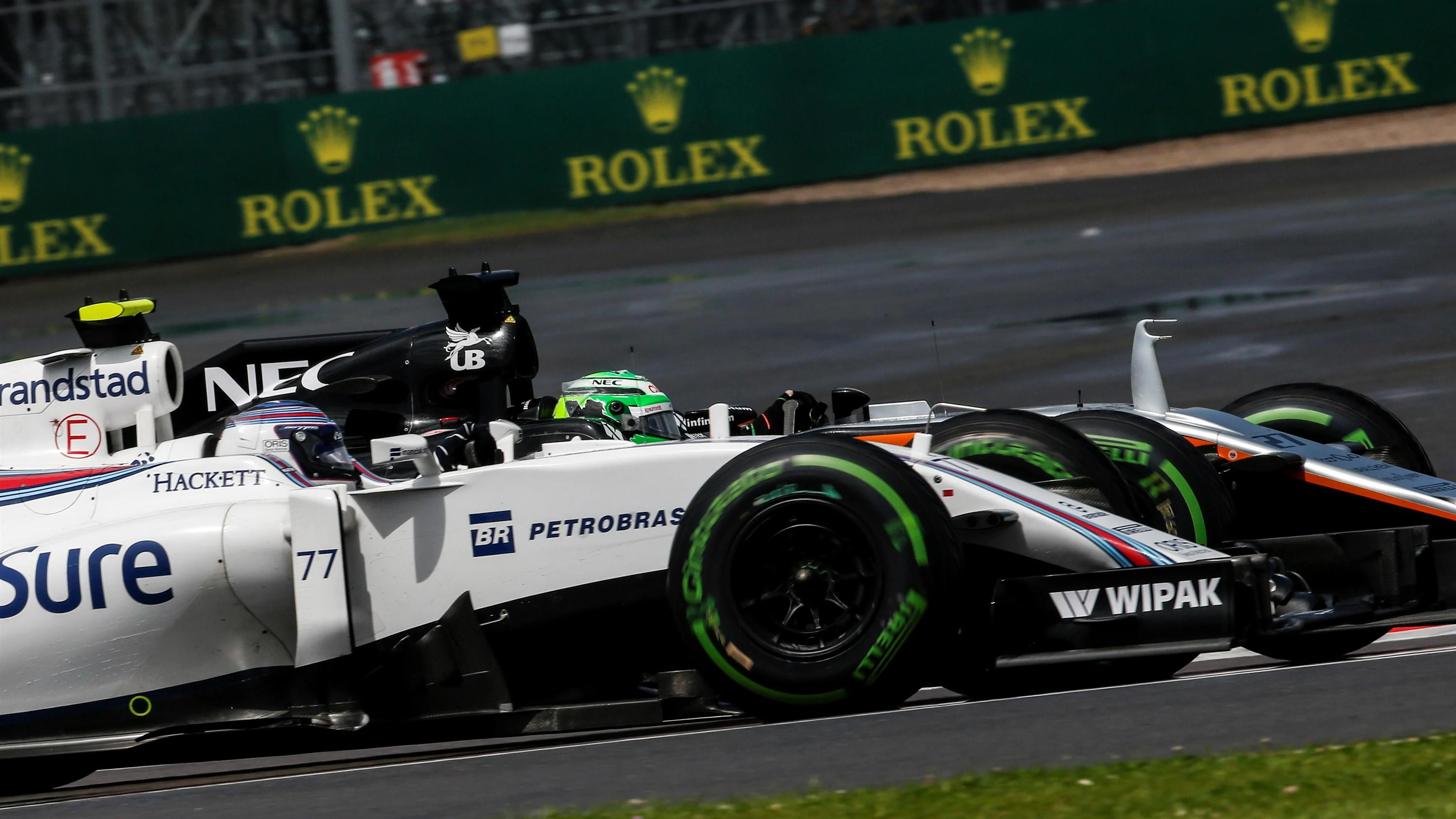 Valtteri Bottas (FIN) Williams FW38 and Sergio Perez (MEX) Force India VJM09 battle for position at