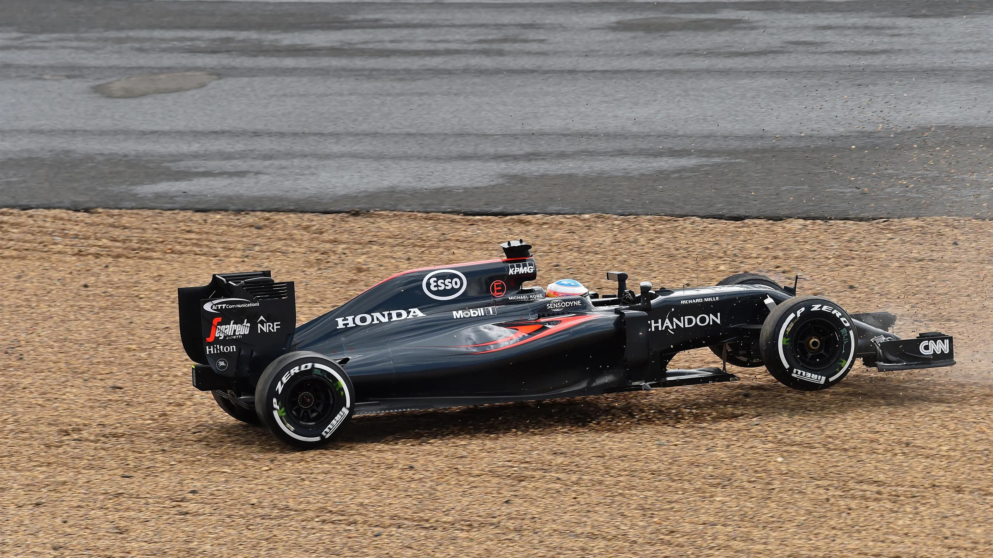 Fernando Alonso (ESP) McLaren MP4-31 spins at Formula One World Championship, Rd10, British Grand