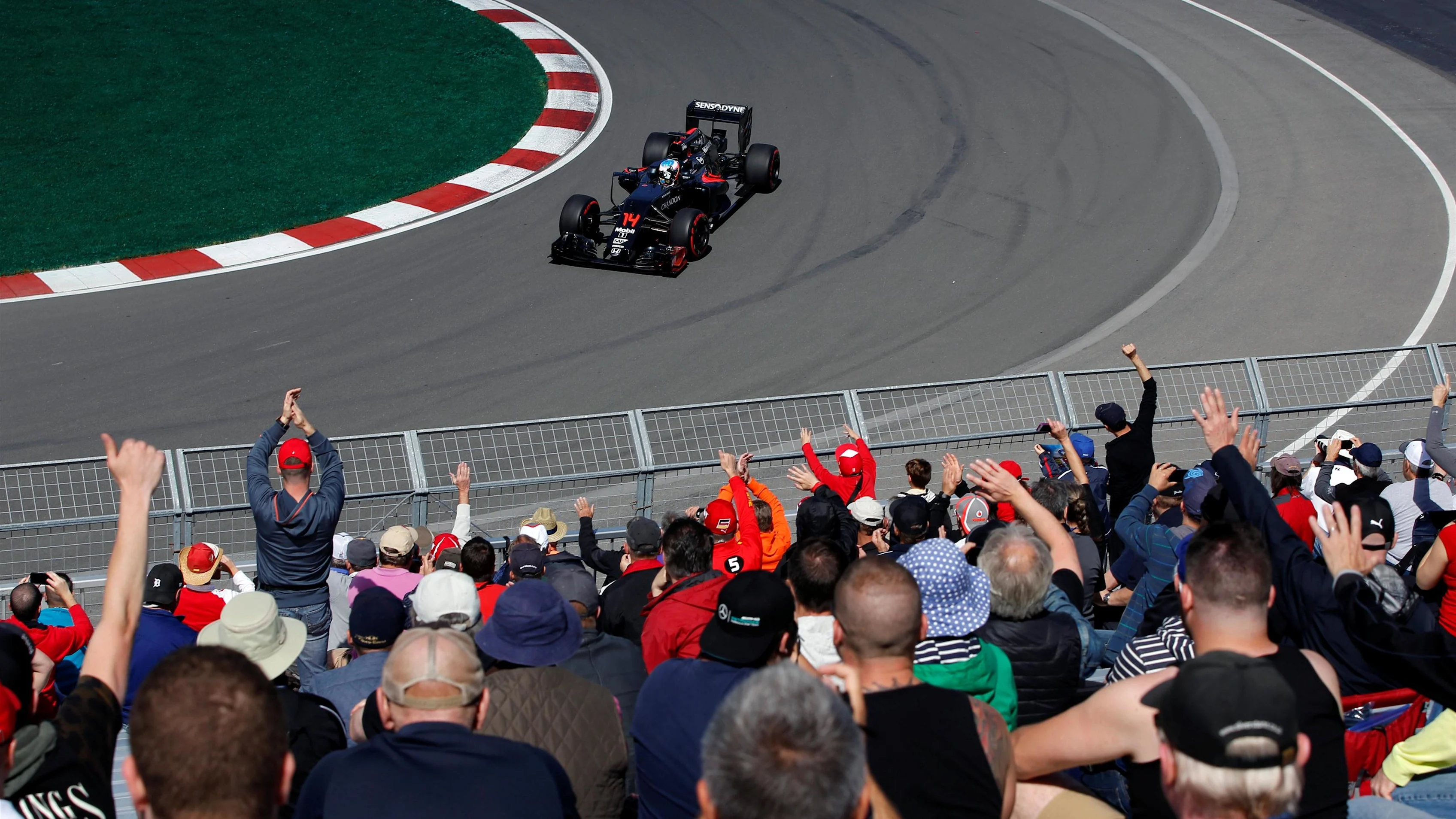 Fernando Alonso (ESP) McLaren MP4-31 waves to the fans at Formula One World Championship, Rd7,
