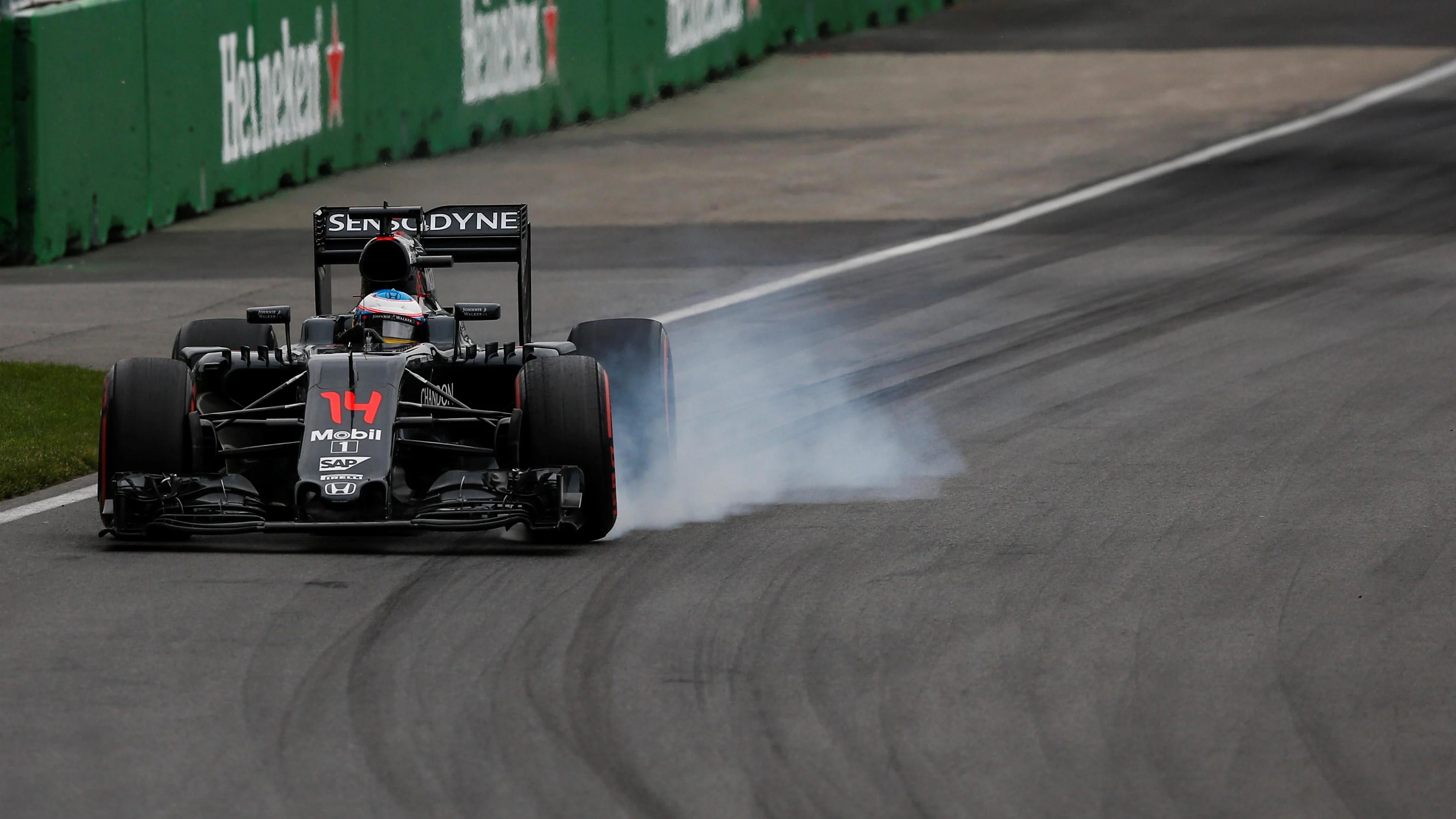 Fernando Alonso (ESP) McLaren MP4-31 locks up at Formula One World Championship, Rd7, Canadian Grand Prix, Qualifying, Montreal, Canada, Saturday 11 June 2016. © Sutton Images