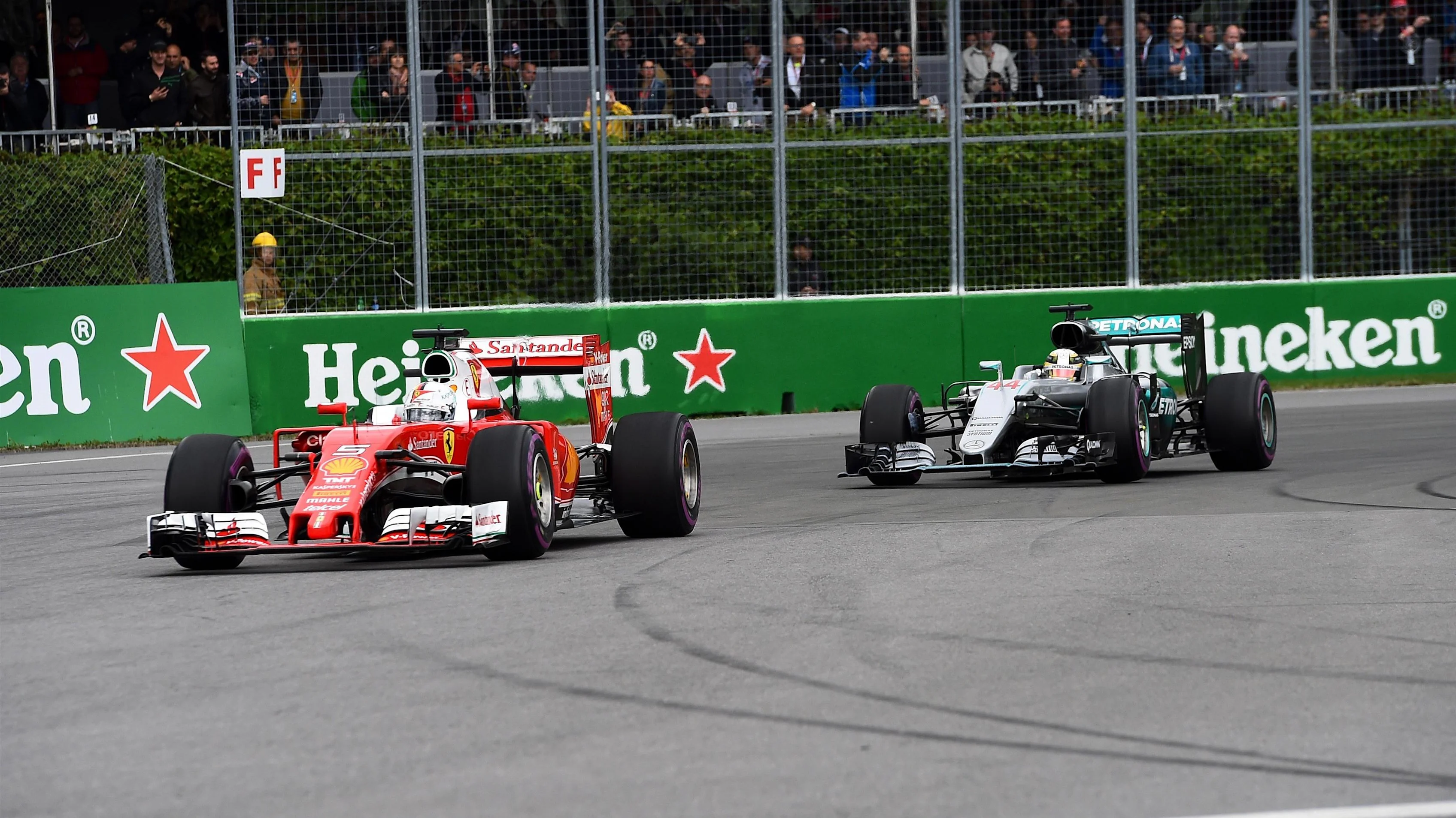 Sebastian Vettel (GER) Ferrari SF16-H leads Lewis Hamilton (GBR) Mercedes-Benz F1 W07 Hybrid at