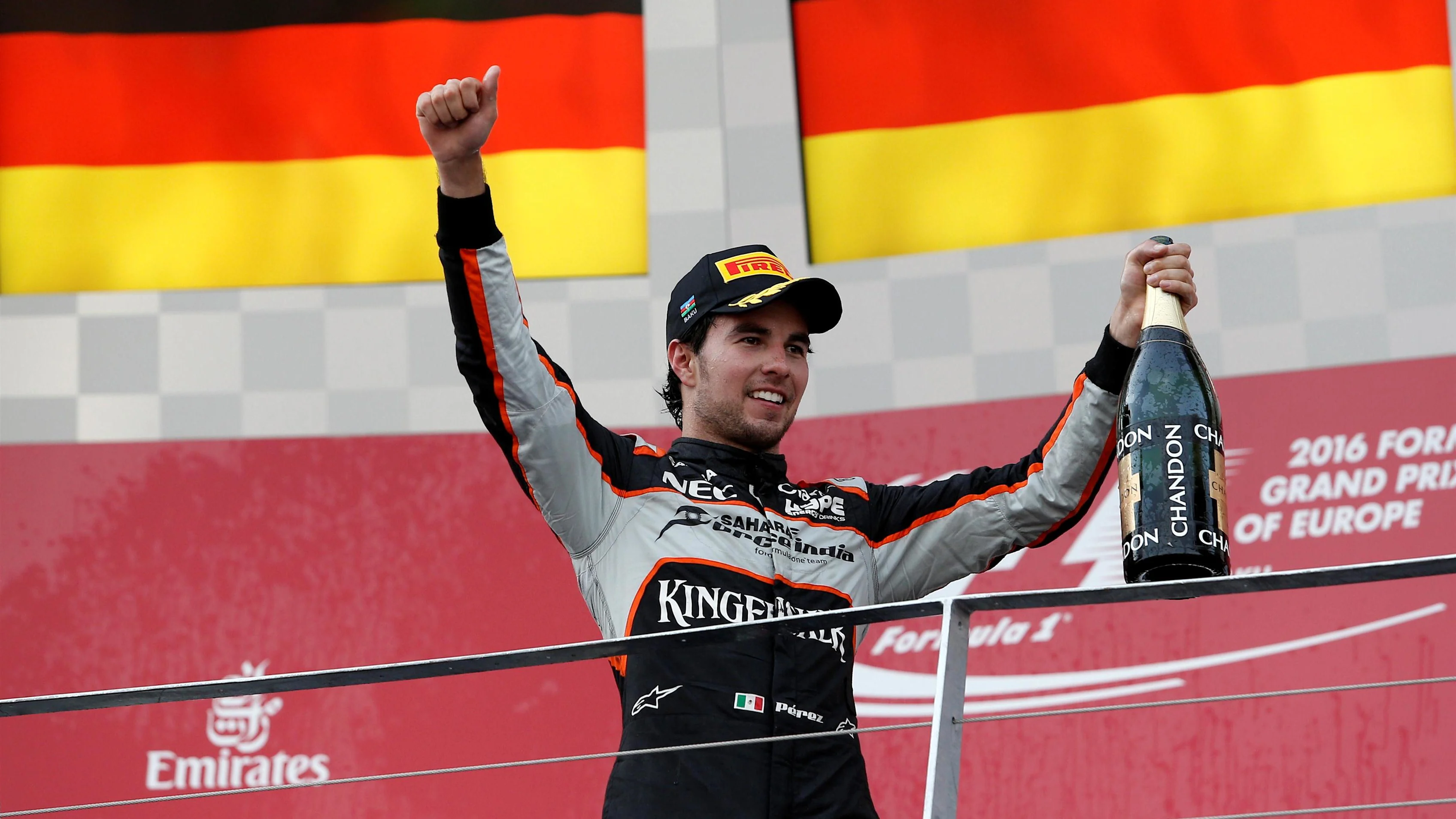Sergio Perez (MEX) Force India celebrates on the podium with the champagne at Formula One World